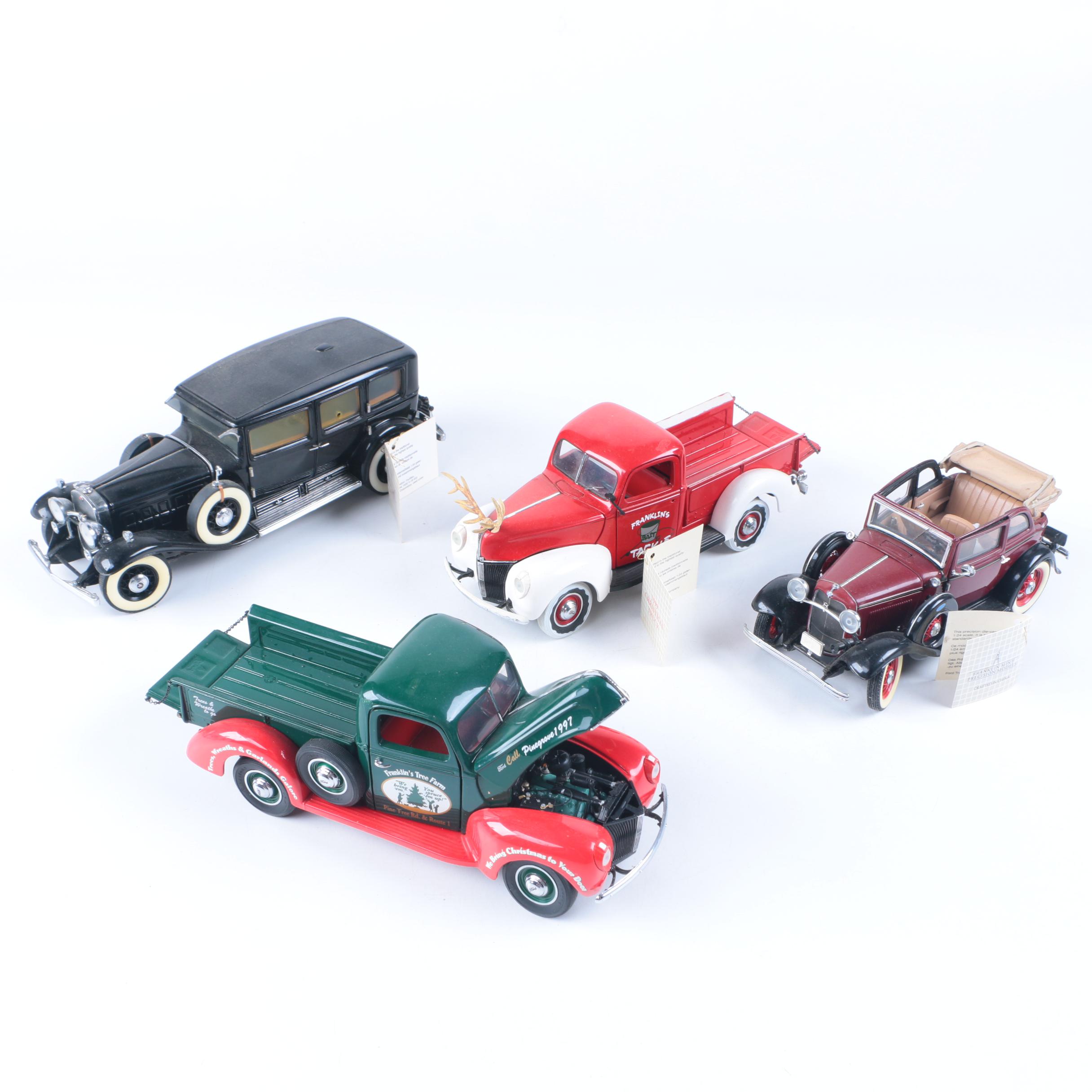 Four Franklin Mint Die-Cast Cars