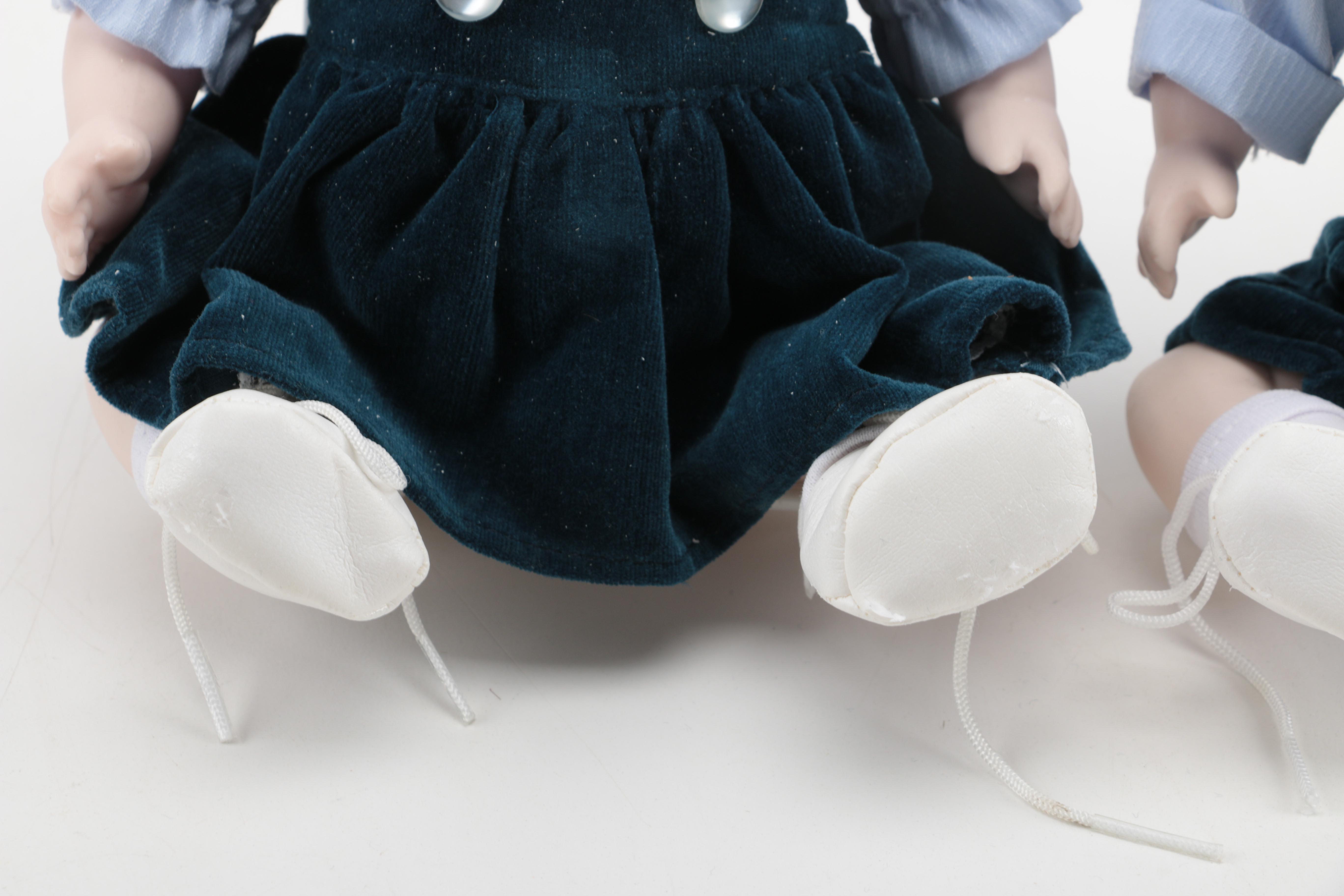 Pair of Boy and Girl Ceramic Dolls