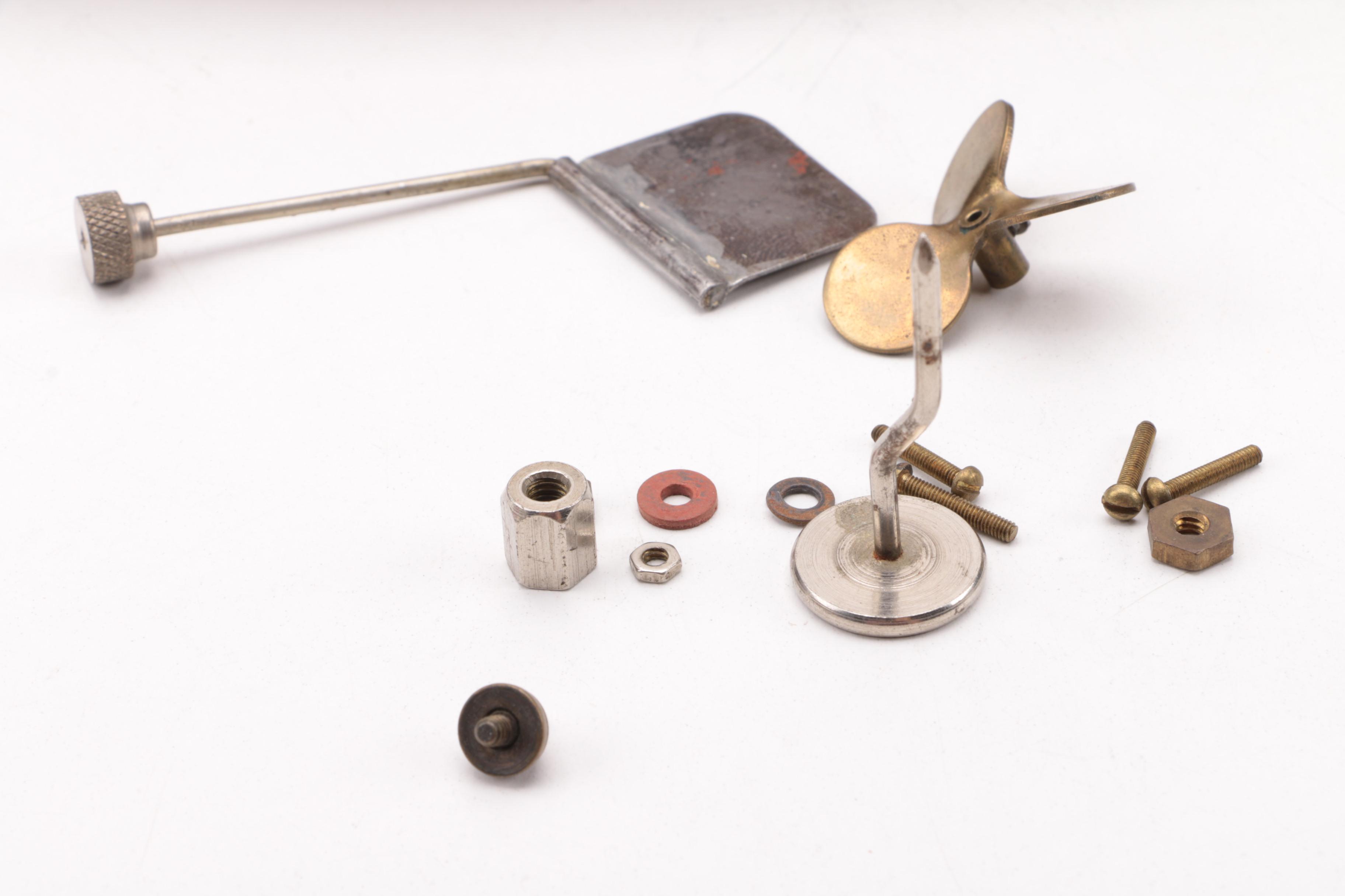 Windup Toy Boat and Vintage Miniature Evinrude Big Twin Outboard Motor