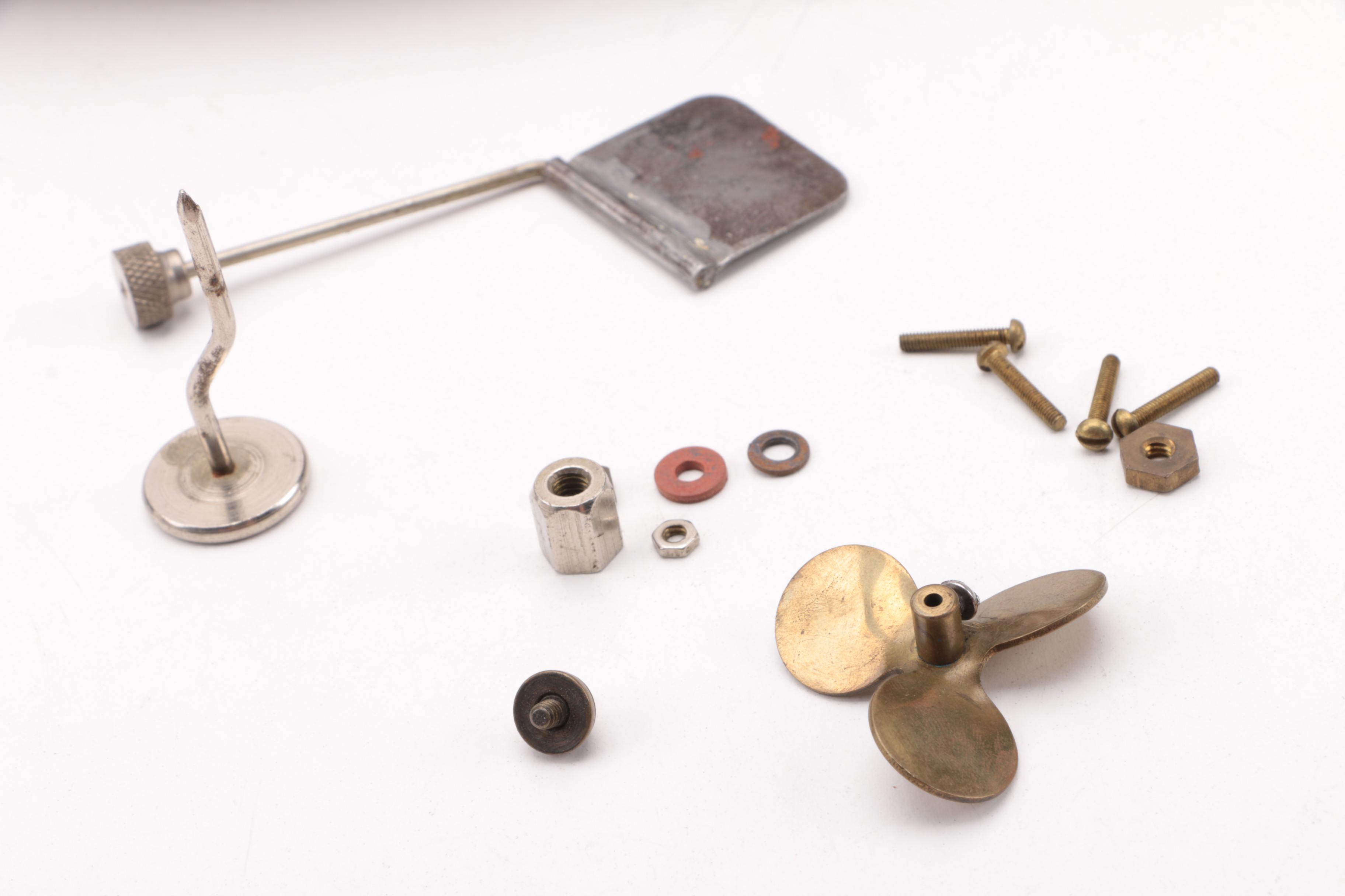 Windup Toy Boat and Vintage Miniature Evinrude Big Twin Outboard Motor