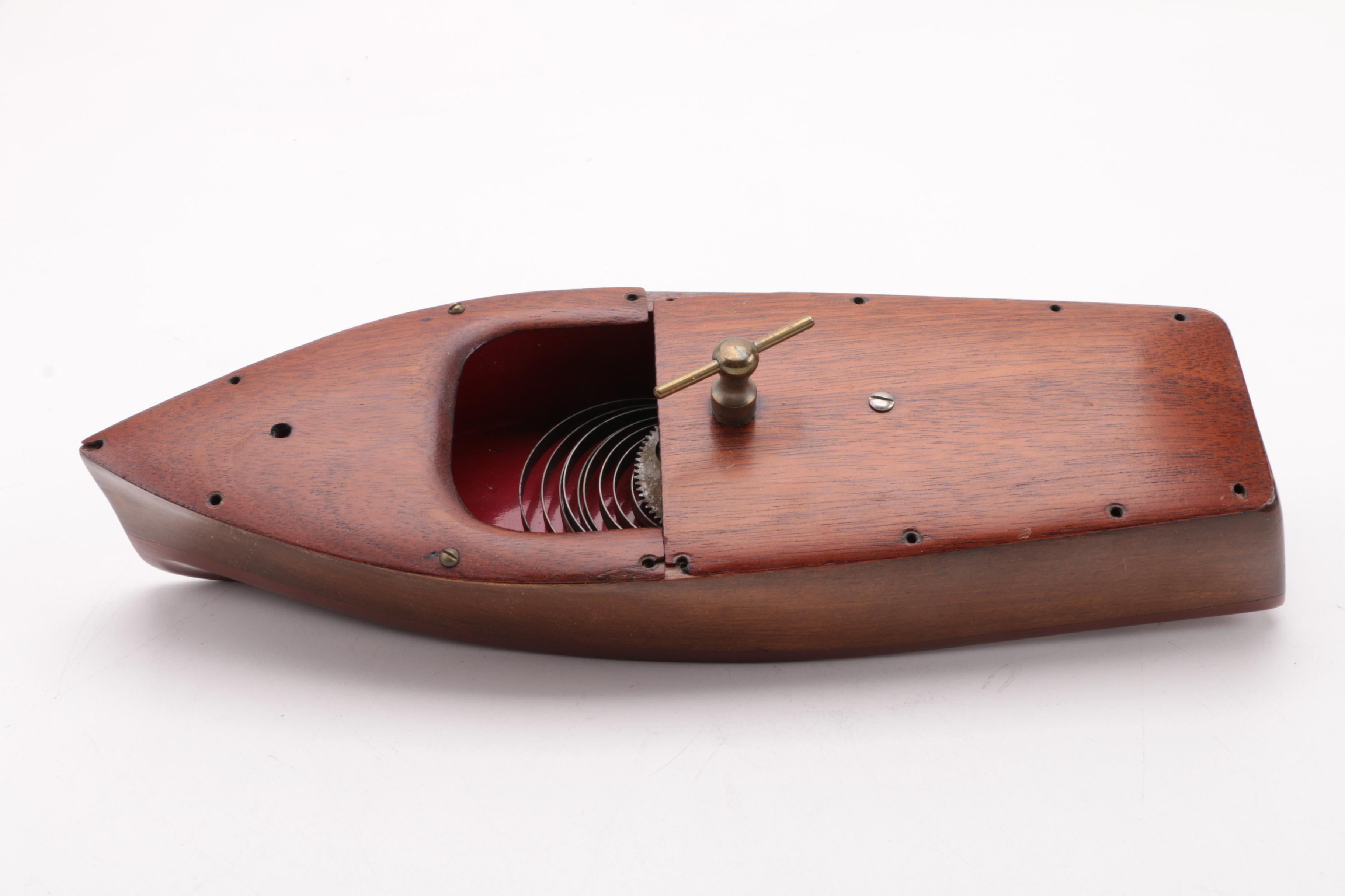 Windup Toy Boat and Vintage Miniature Evinrude Big Twin Outboard Motor