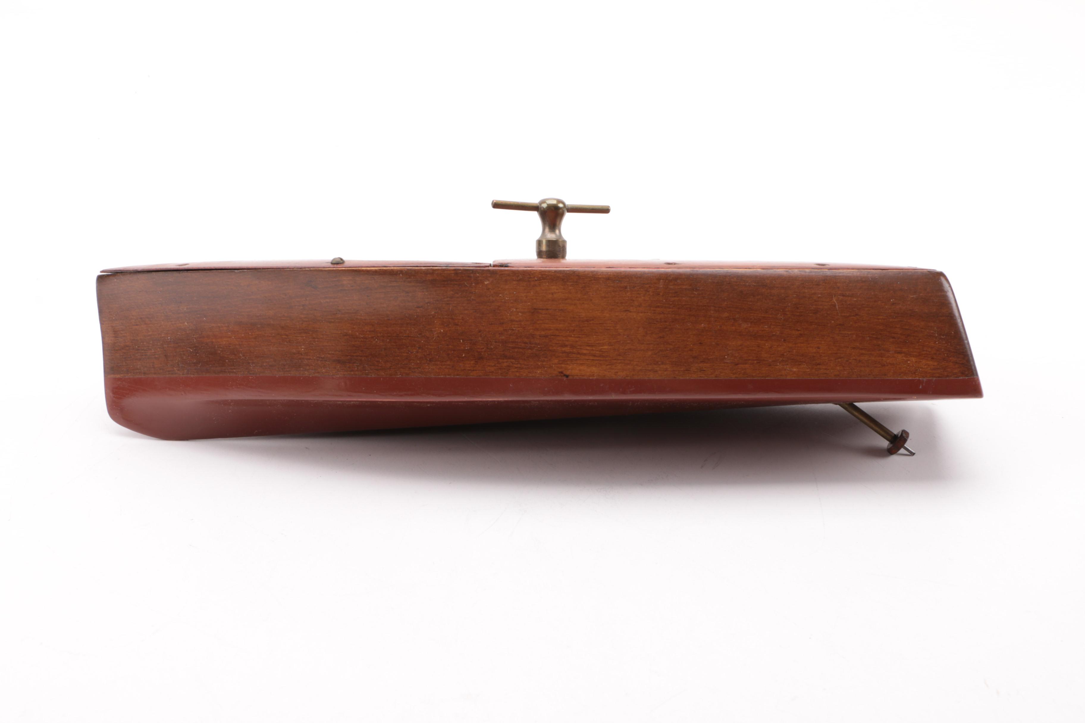 Windup Toy Boat and Vintage Miniature Evinrude Big Twin Outboard Motor