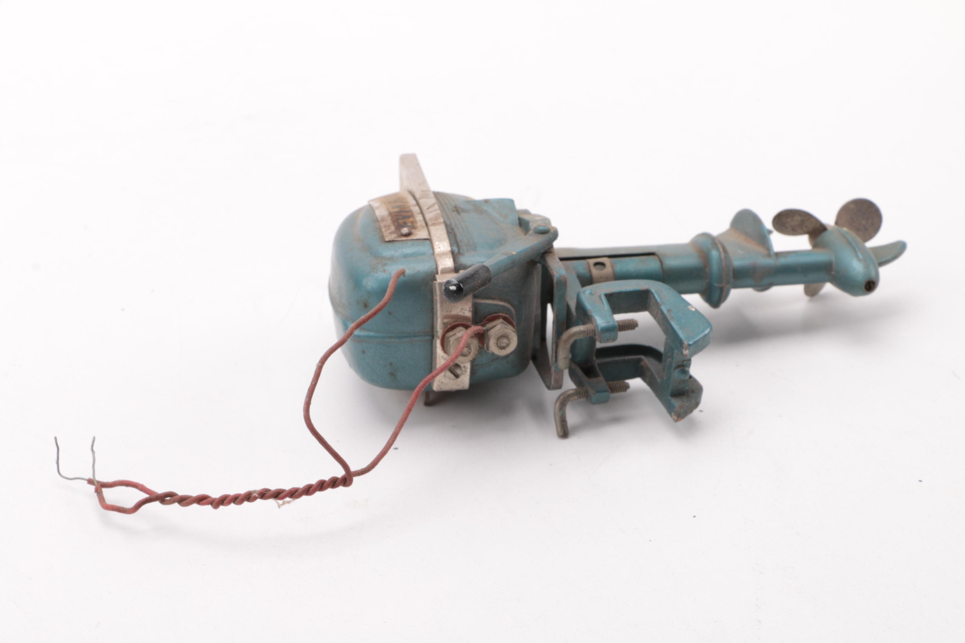 Windup Toy Boat and Vintage Miniature Evinrude Big Twin Outboard Motor