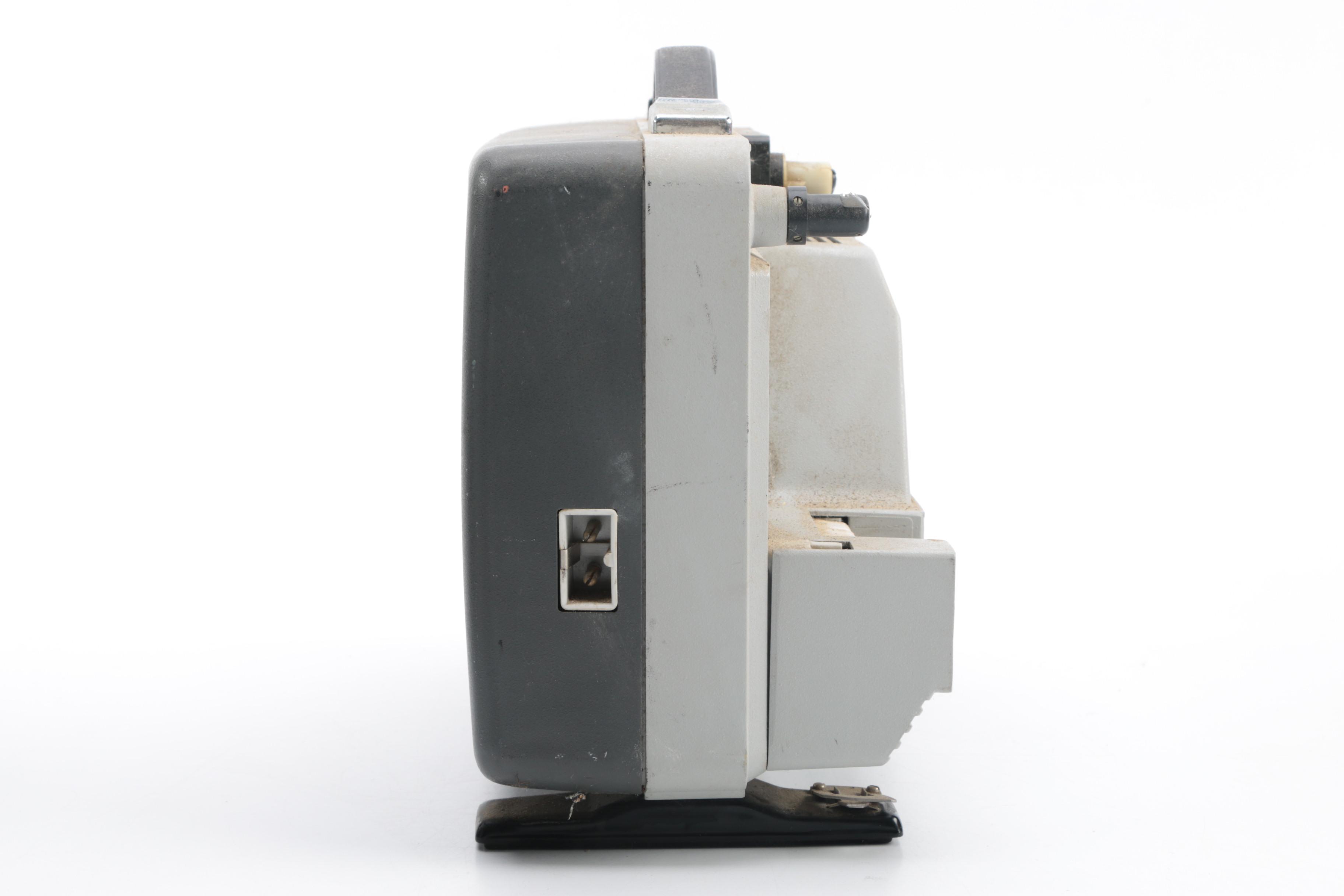 Vintage Cavalier Dual Eight Film Projector and 45 rpm Records