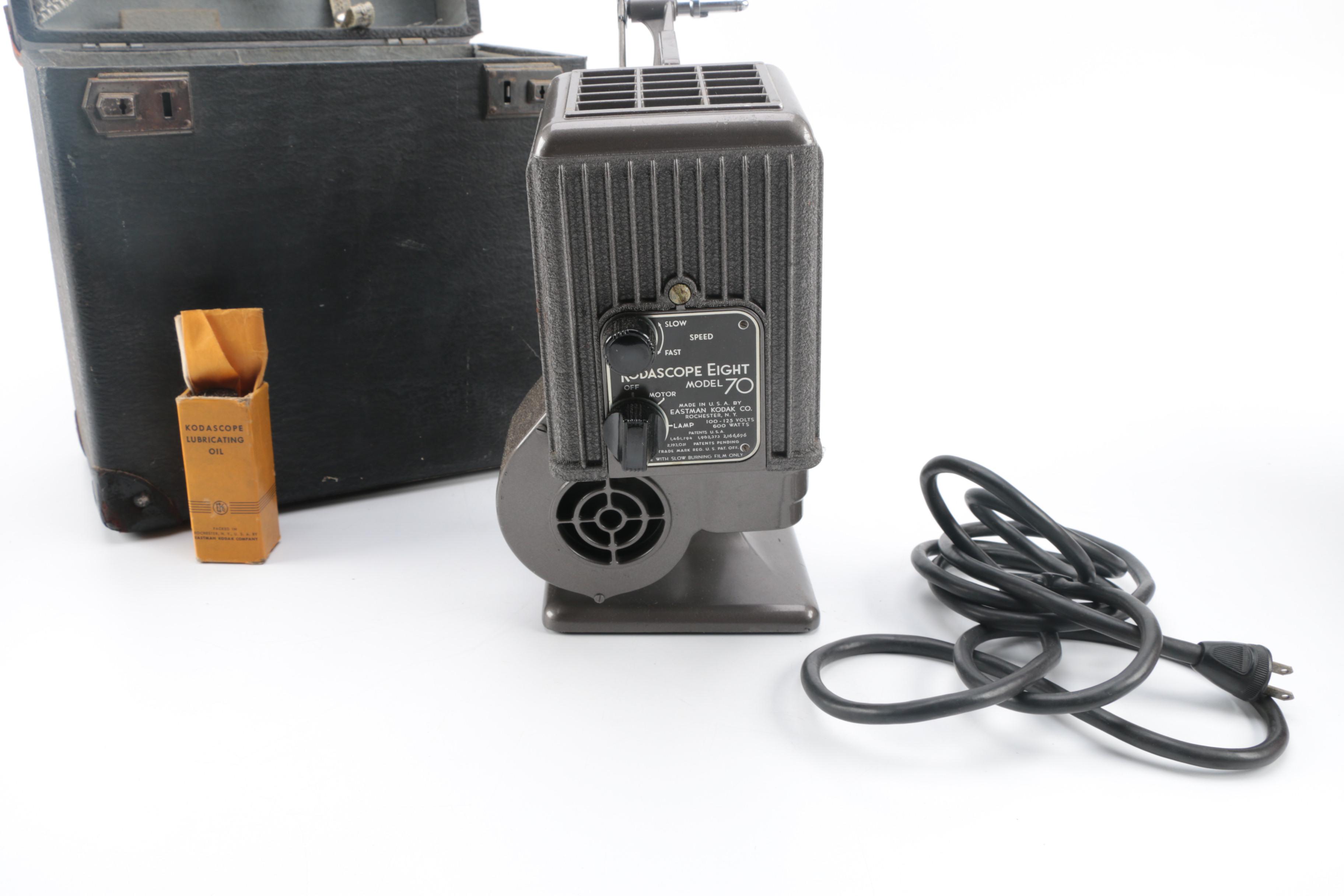 Vintage Cavalier Dual Eight Film Projector and 45 rpm Records