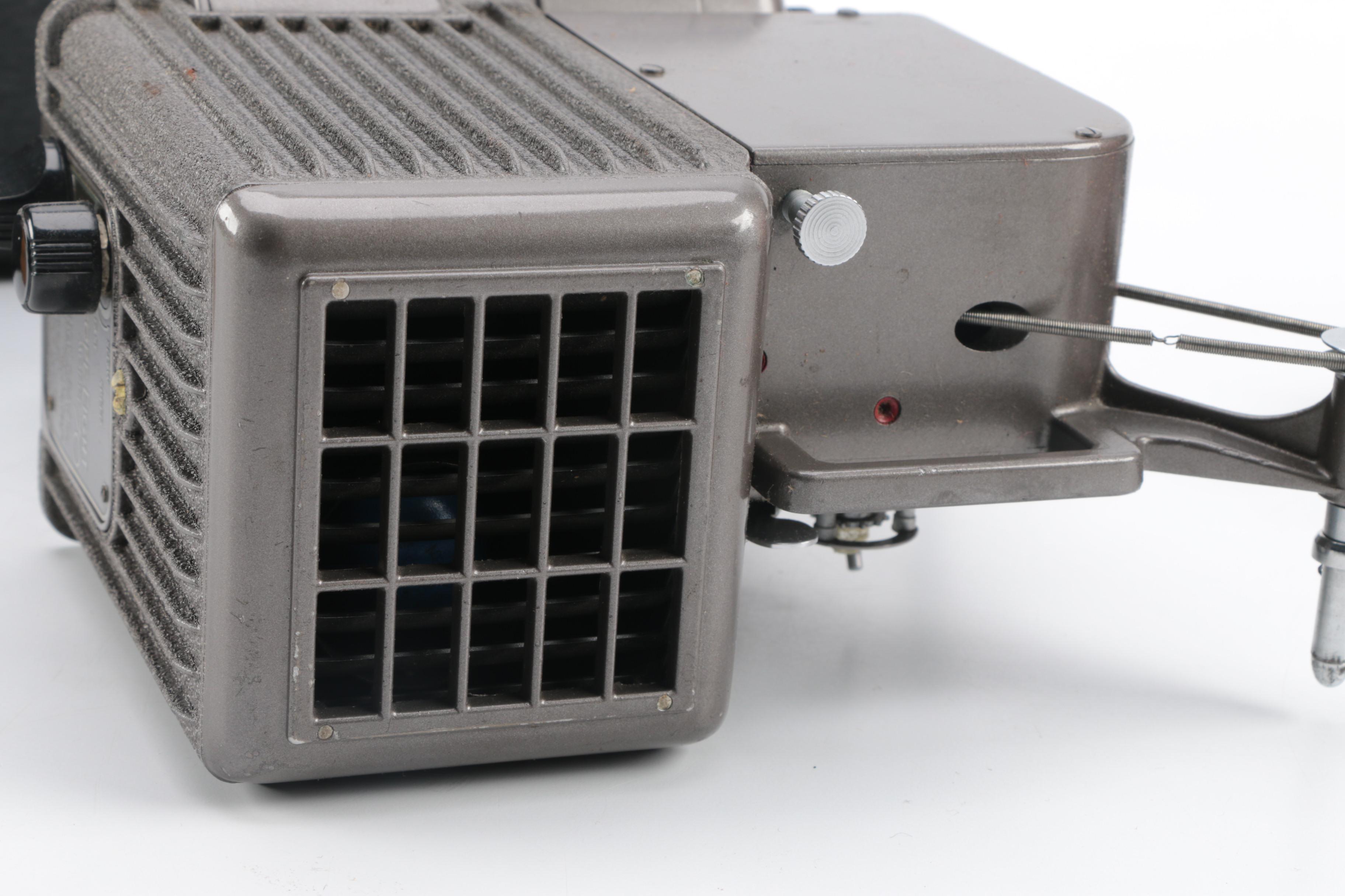 Vintage Cavalier Dual Eight Film Projector and 45 rpm Records