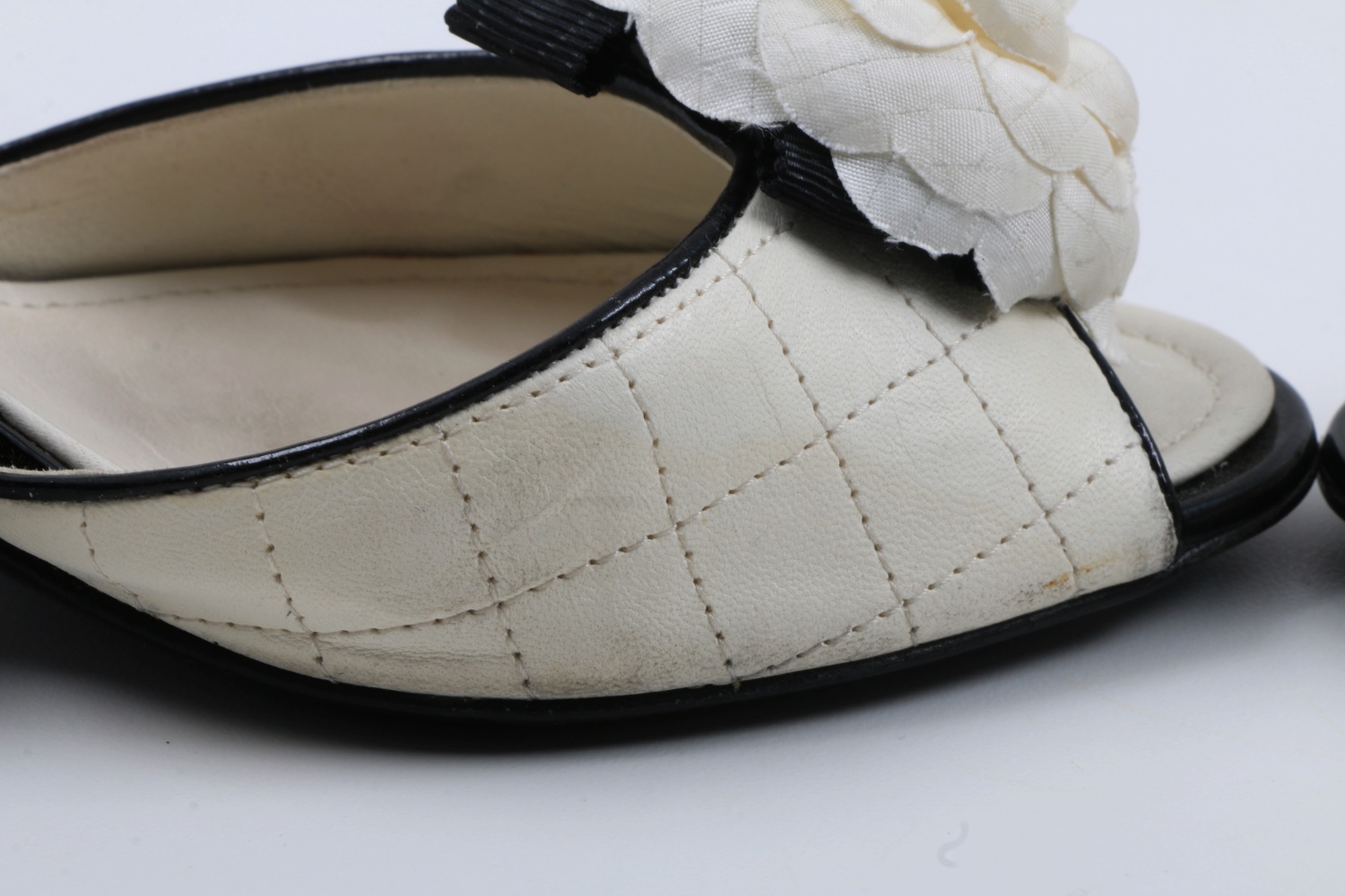 "Chanel" Blanc et Noir Quilted Mules with Rosettes