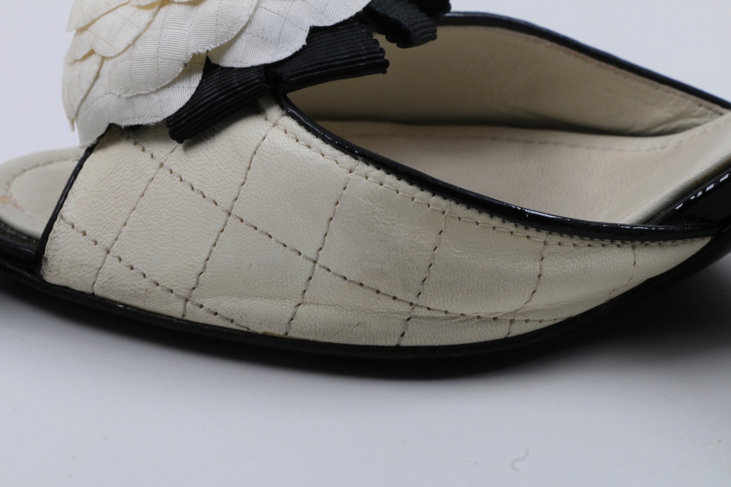 "Chanel" Blanc et Noir Quilted Mules with Rosettes