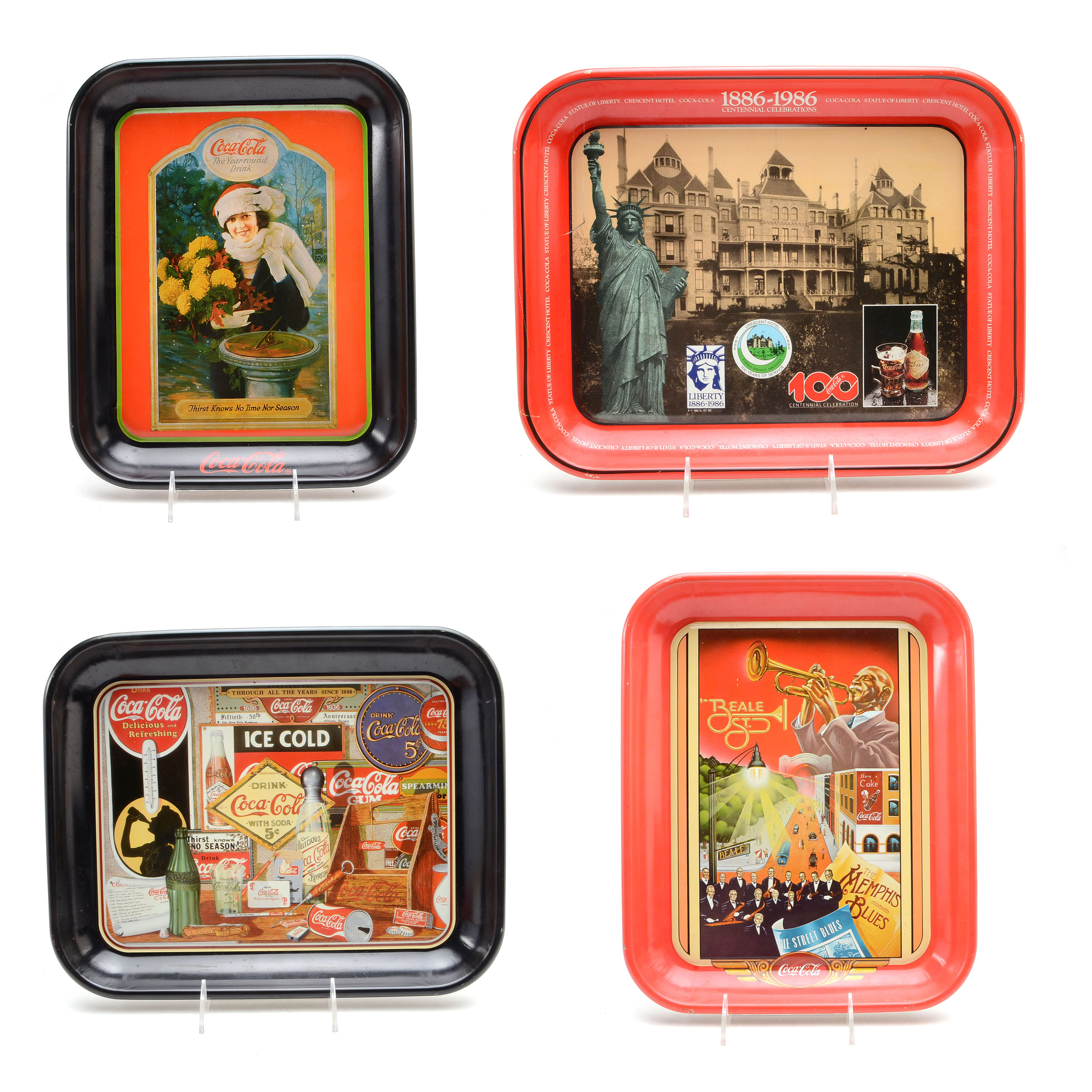 Four Coca-Cola Trays