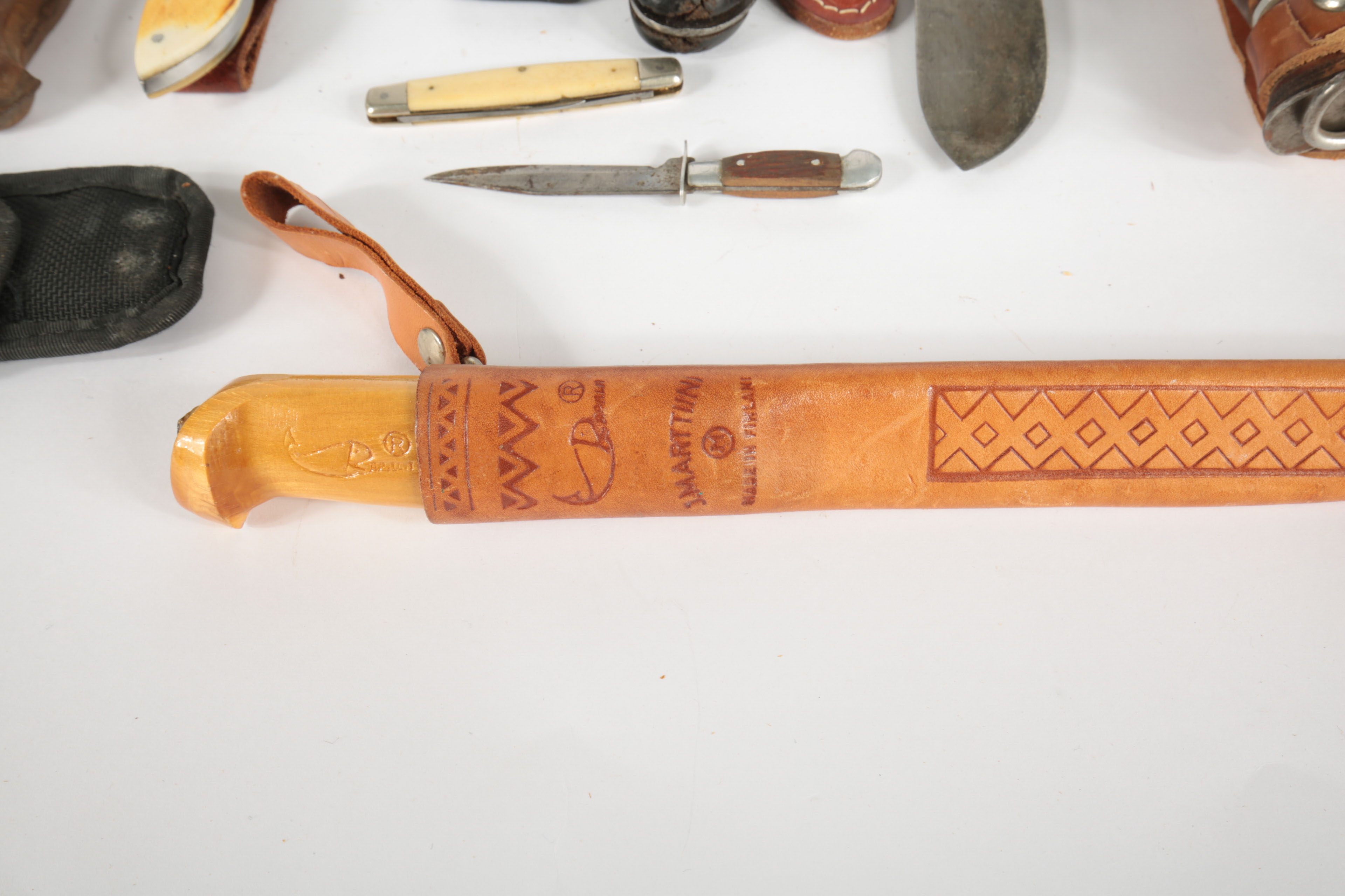 Large Collection of Fixed Blade Knives and a Folding Knife