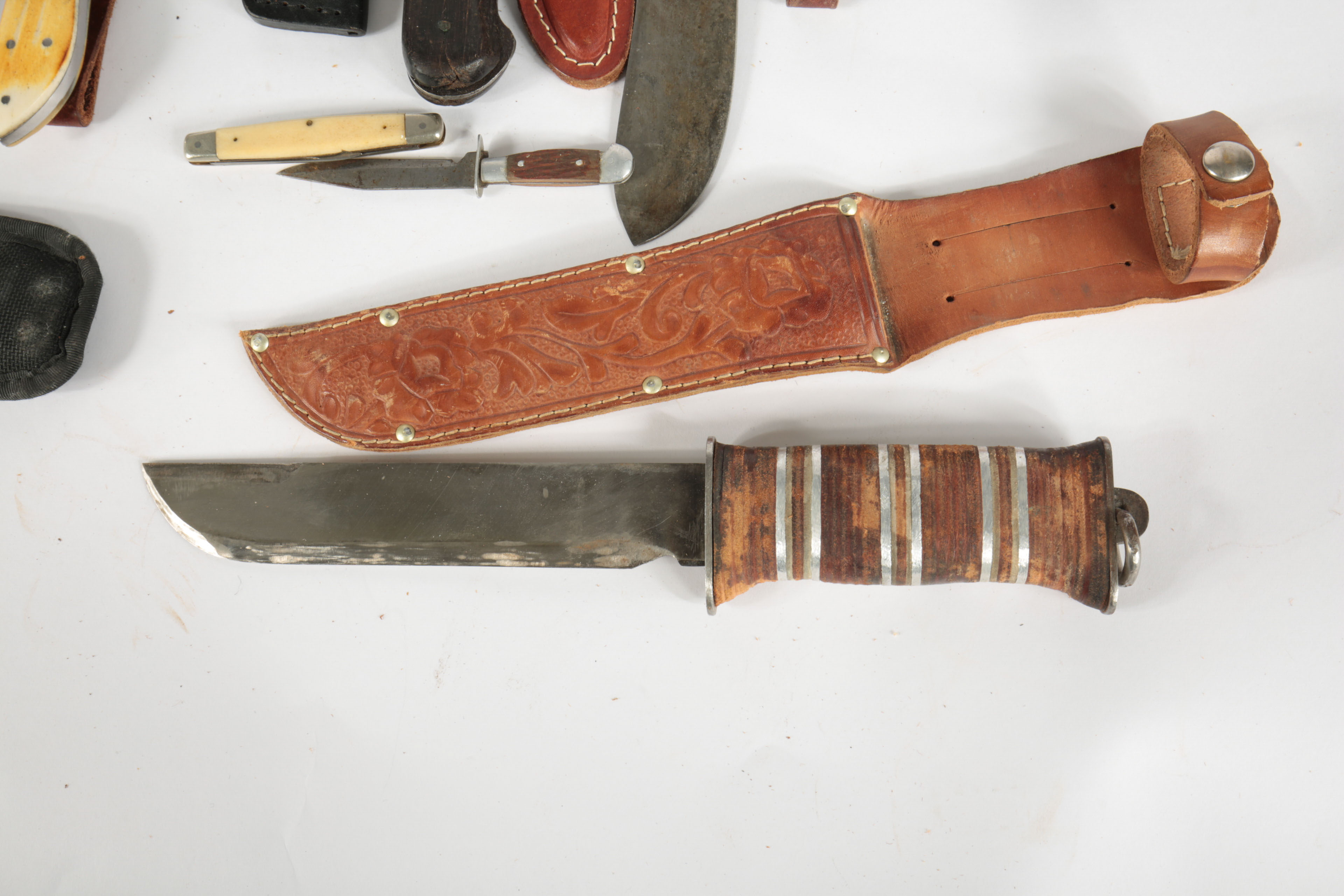 Large Collection of Fixed Blade Knives and a Folding Knife