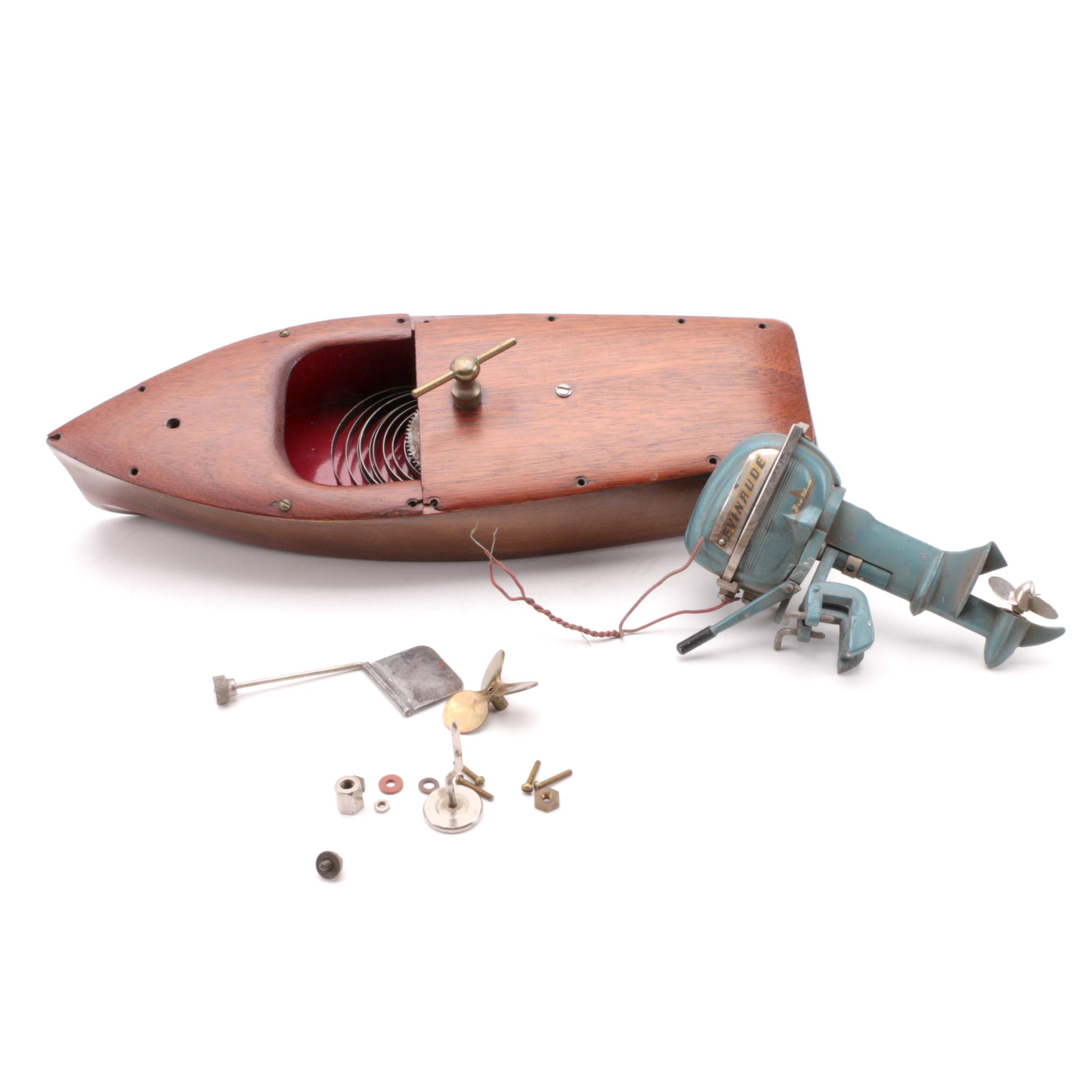 Windup Toy Boat and Vintage Miniature Evinrude Big Twin Outboard Motor
