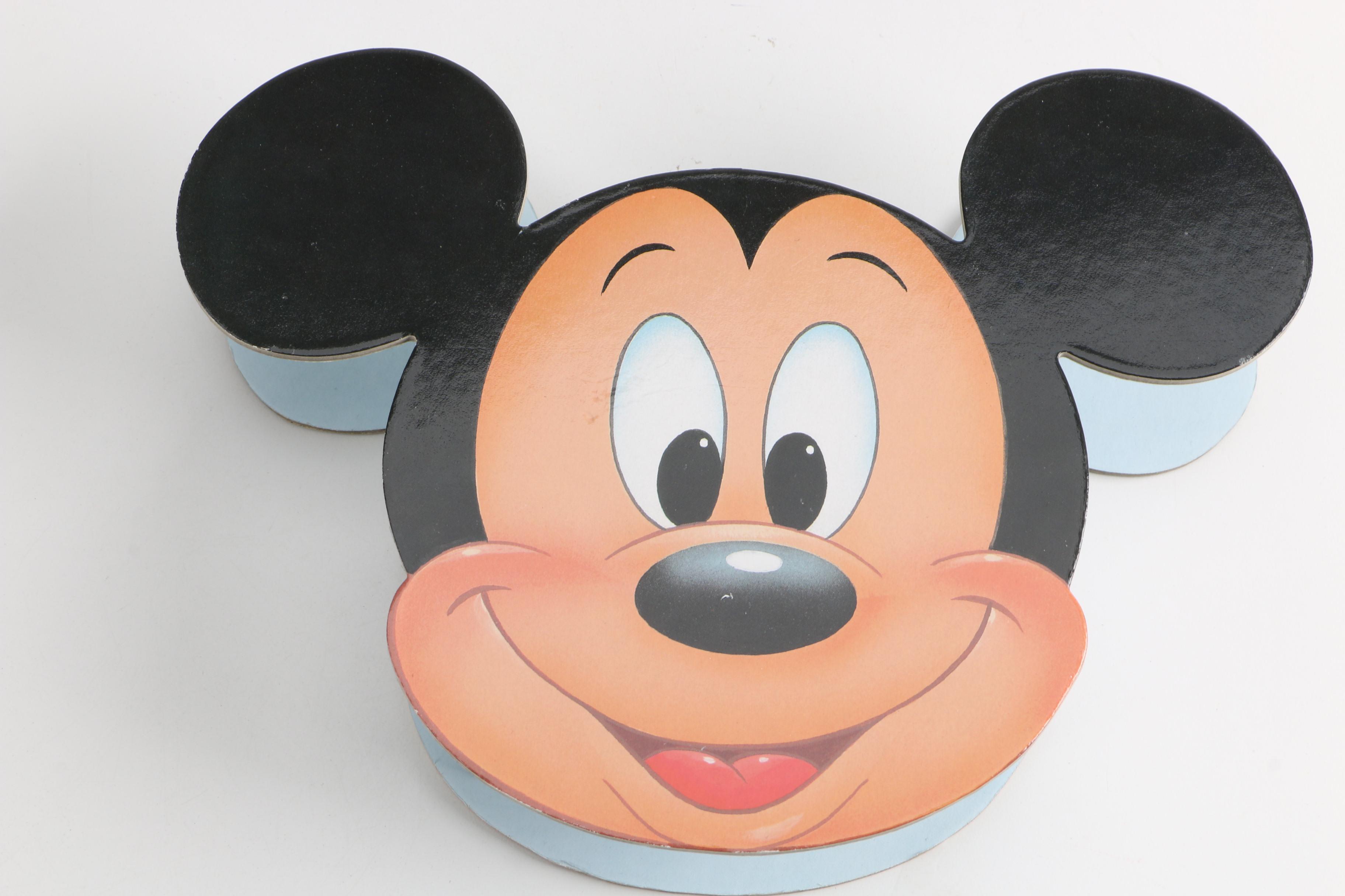 Assortment of Disney Books and Merchandise