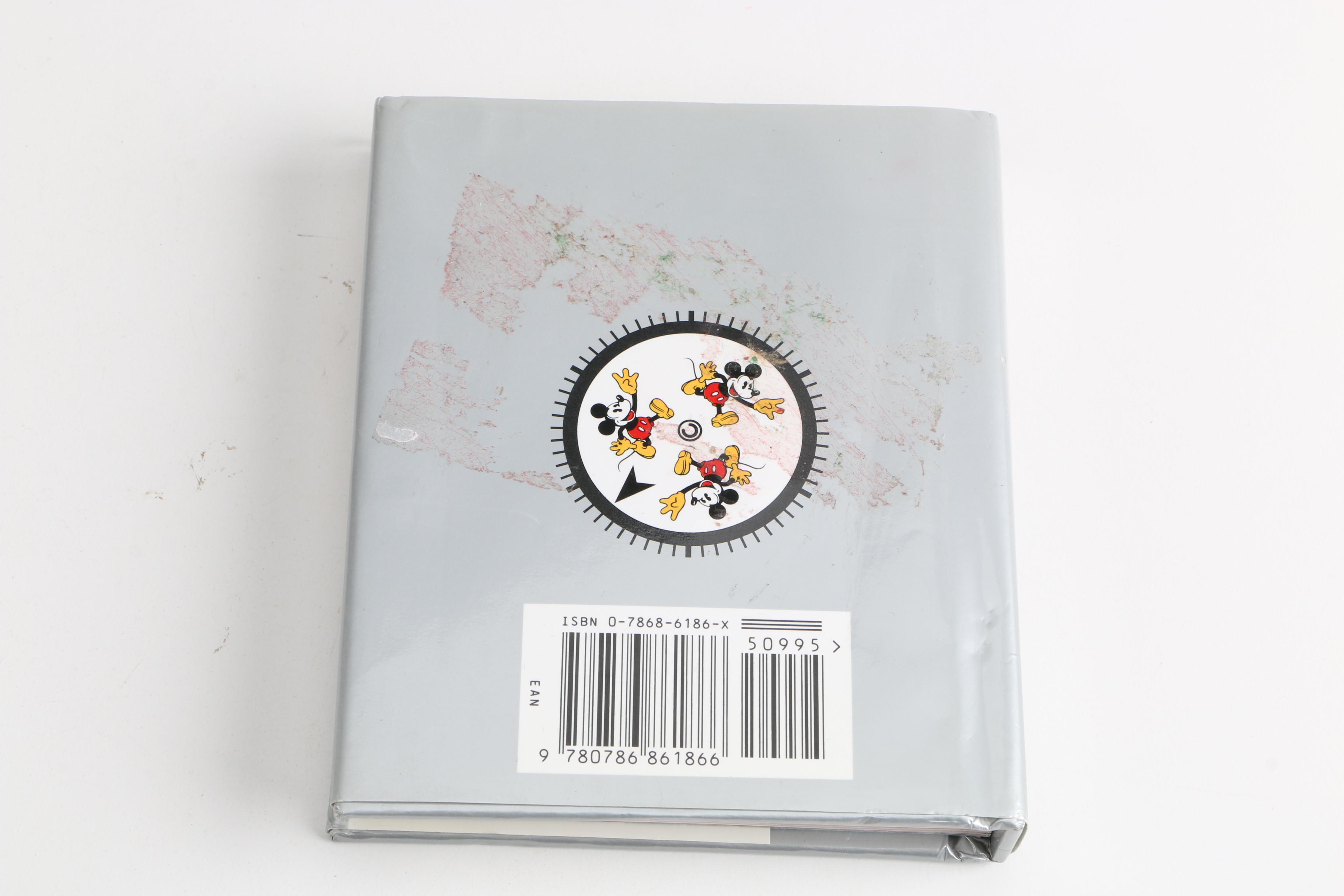 Assortment of Disney Books and Merchandise