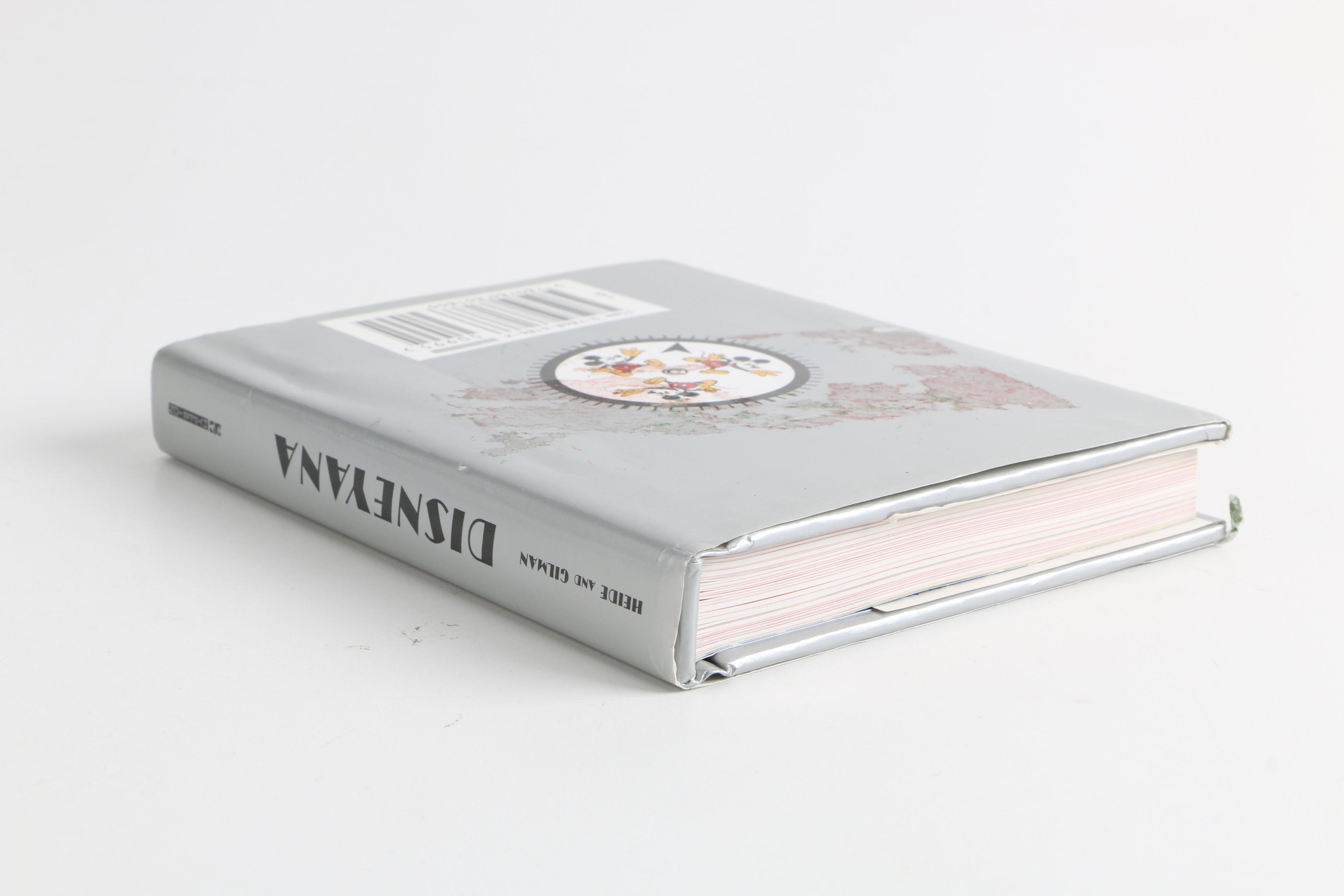 Assortment of Disney Books and Merchandise