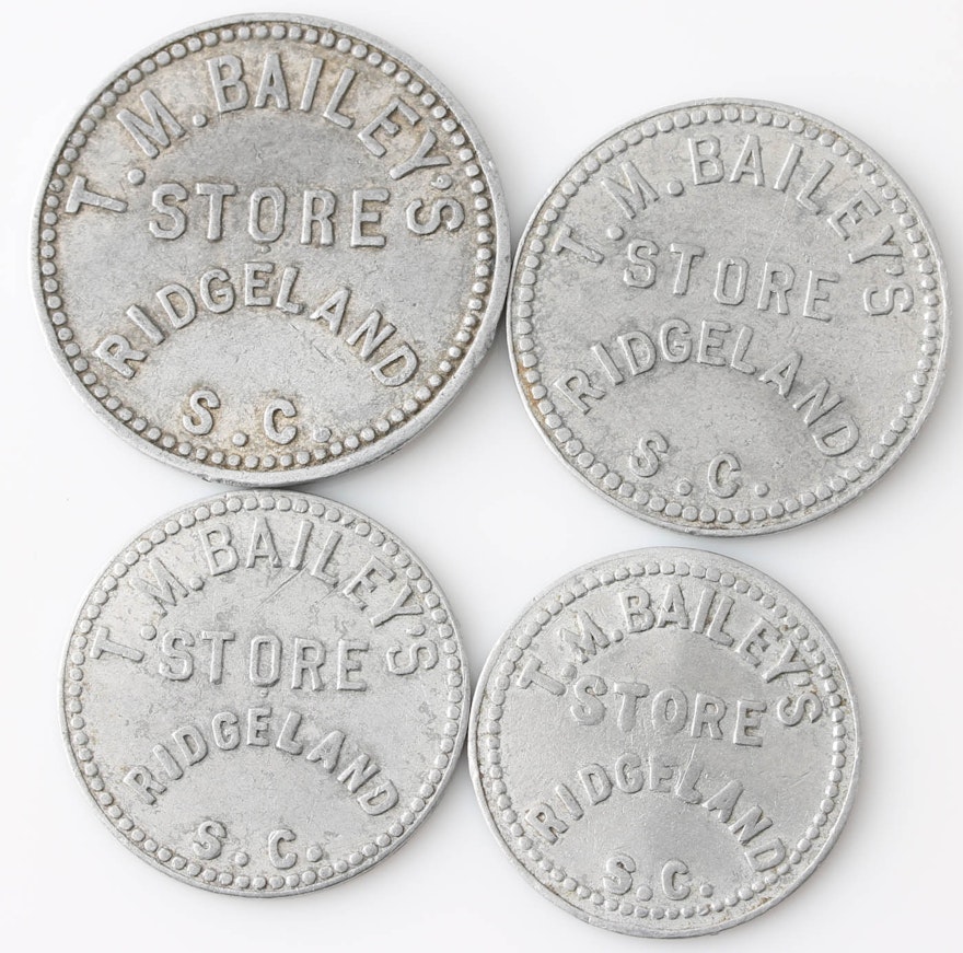 Set of Four Vintage Store Tokens For T.M. Bailey's Store