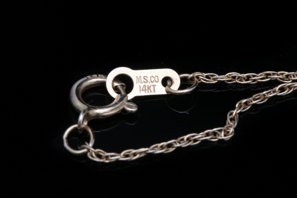 A 14K Two-Tone Gold and Diamond Heart Pendant with Chain