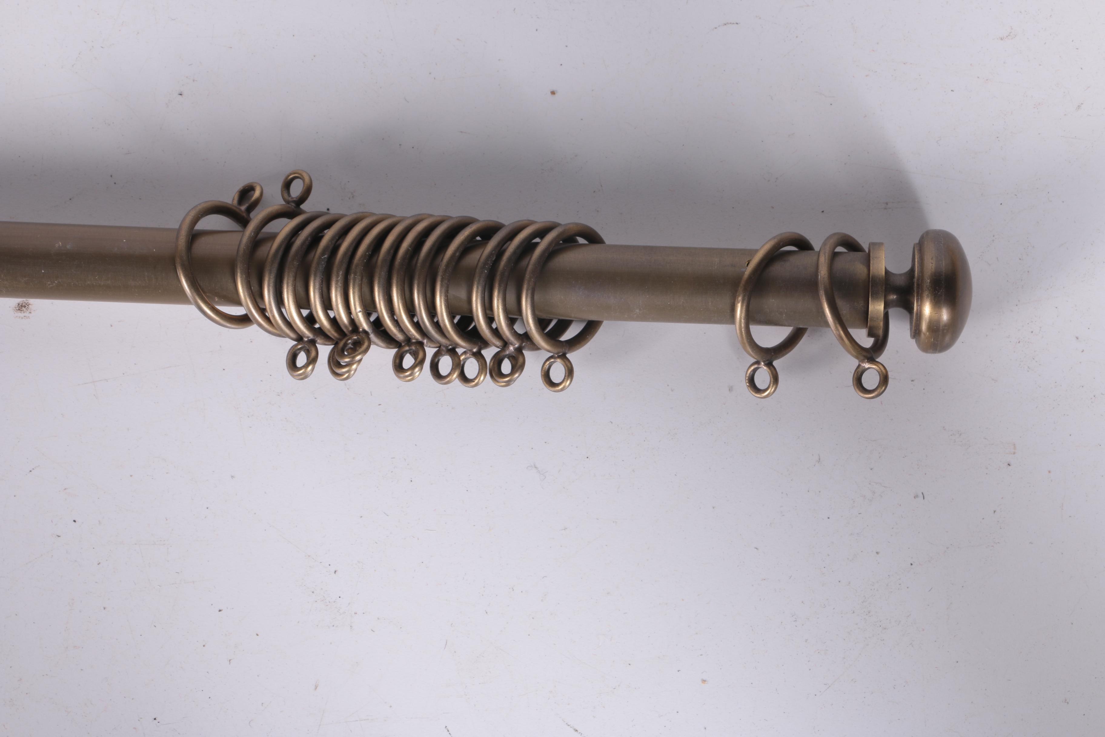 Collection of Ornate Curtain Rods and Rings