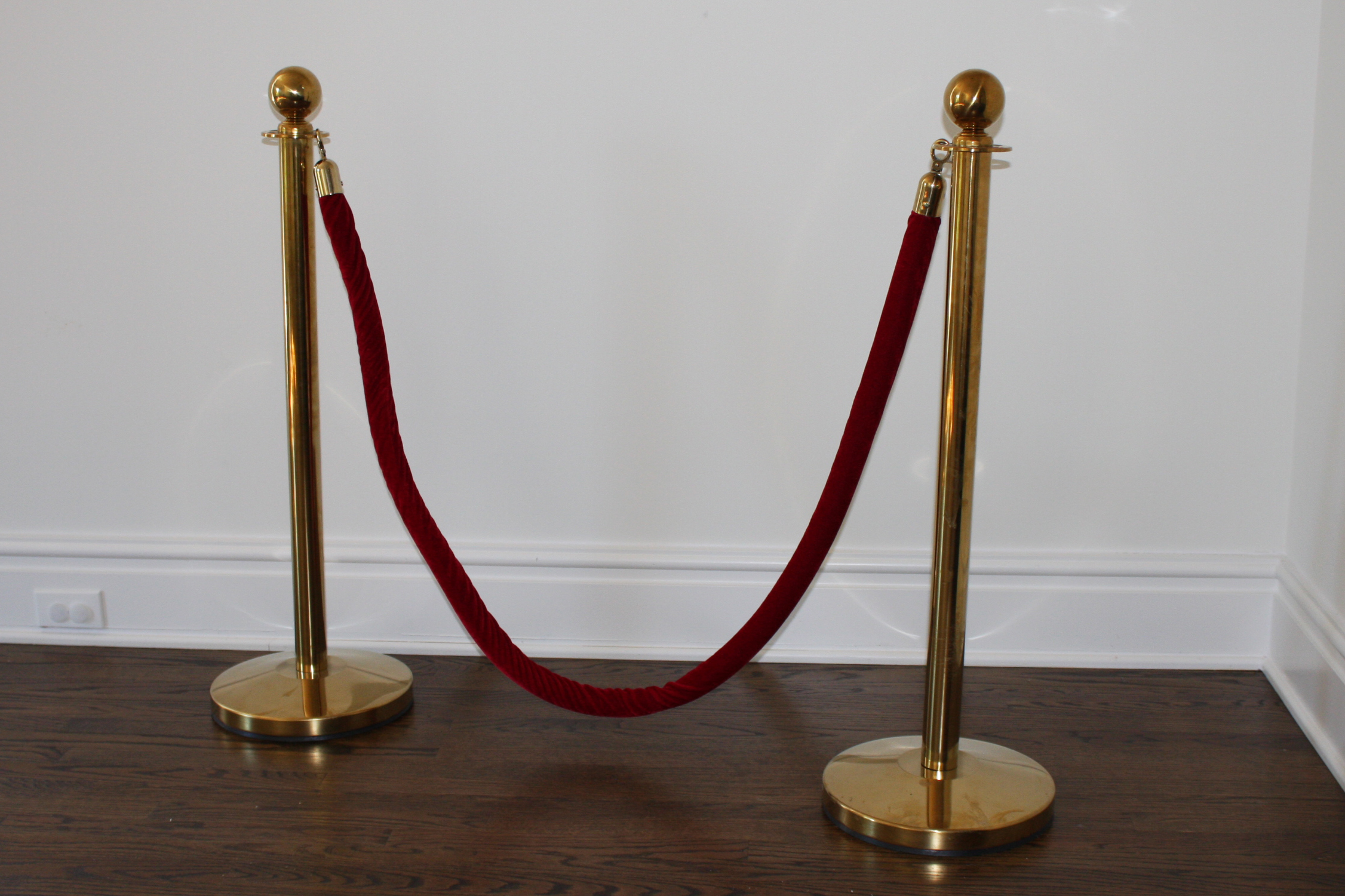 Pair of Brass Stanchions with a Red Velvet Rope