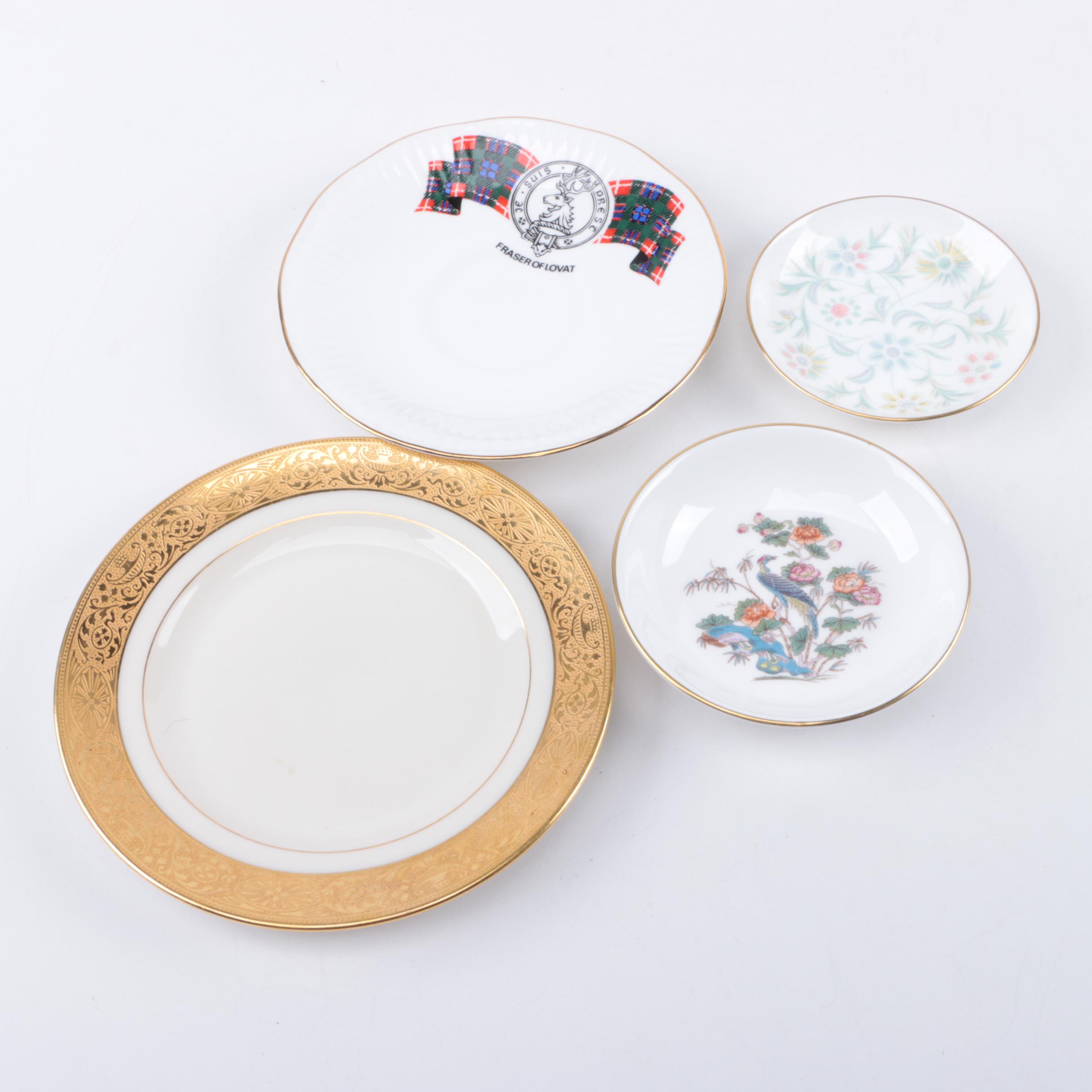 Gold Trimmed Porcelain Plates Featuring Wedgwood