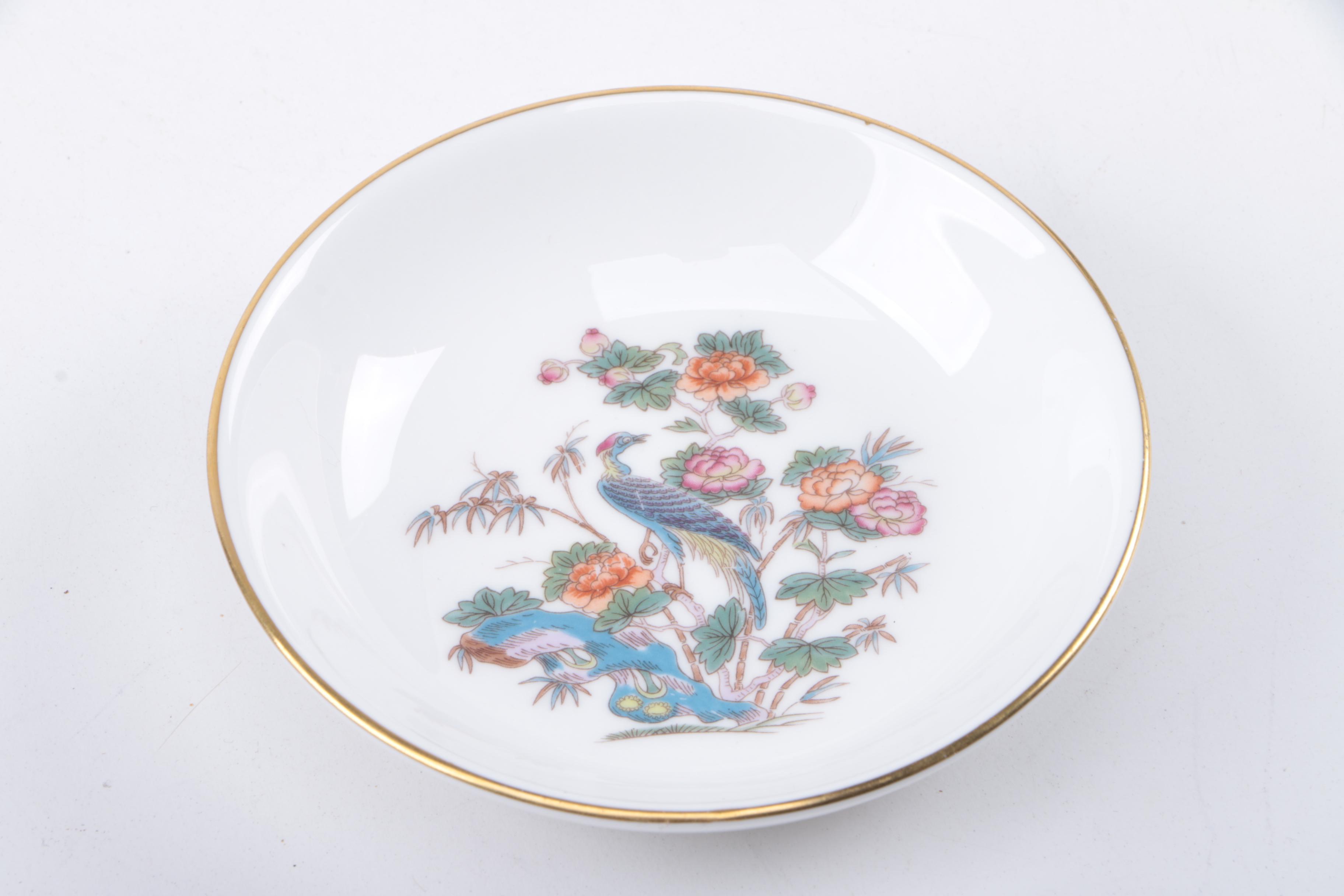 Gold Trimmed Porcelain Plates Featuring Wedgwood