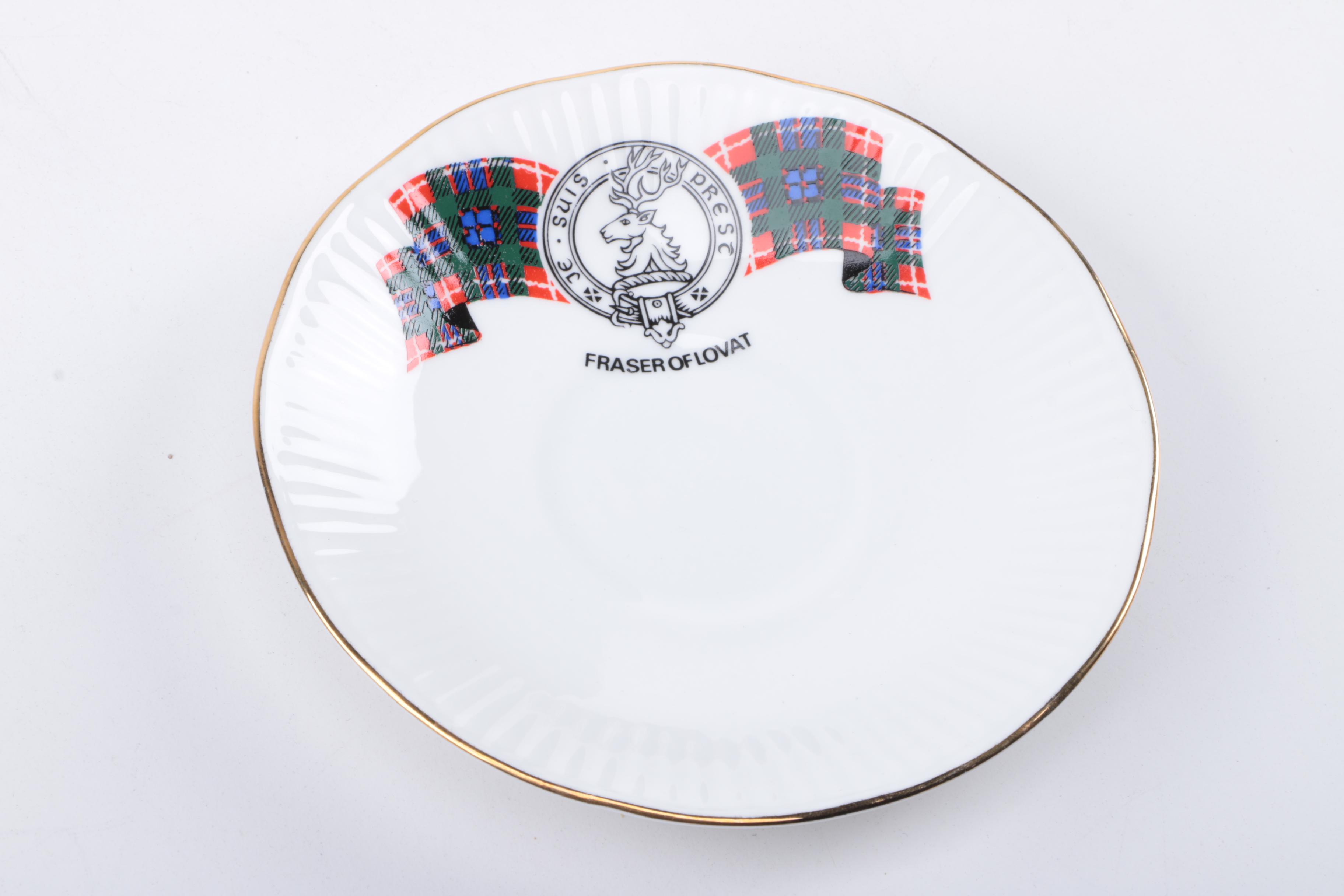 Gold Trimmed Porcelain Plates Featuring Wedgwood