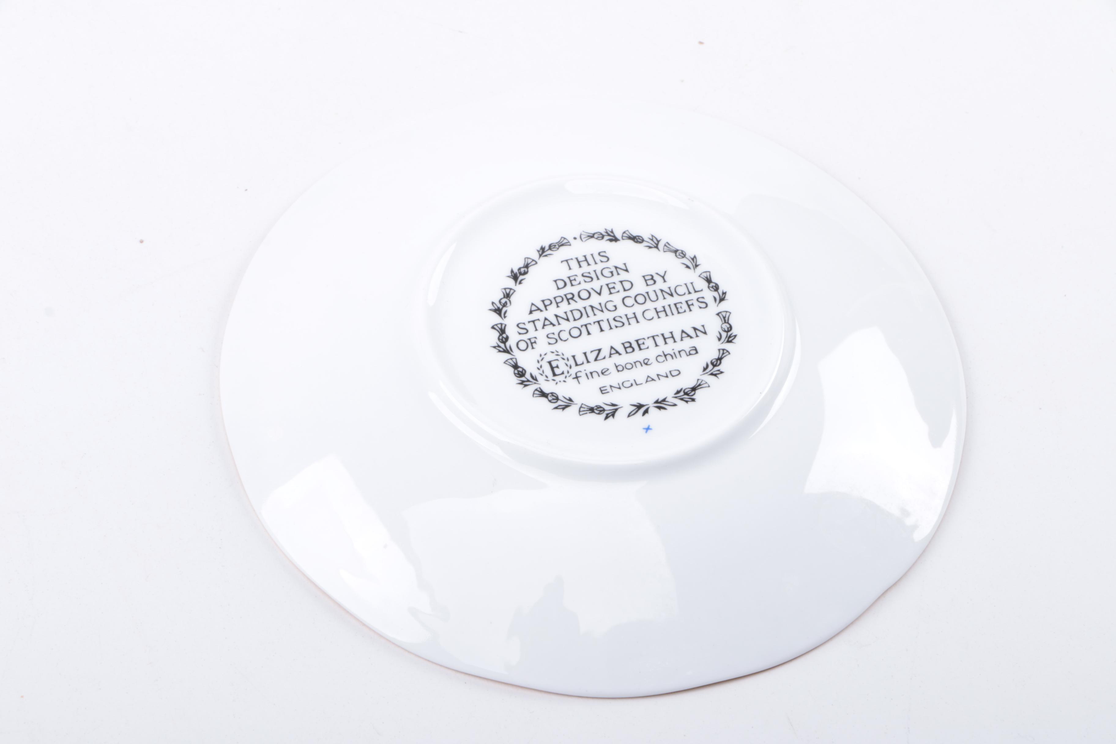 Gold Trimmed Porcelain Plates Featuring Wedgwood