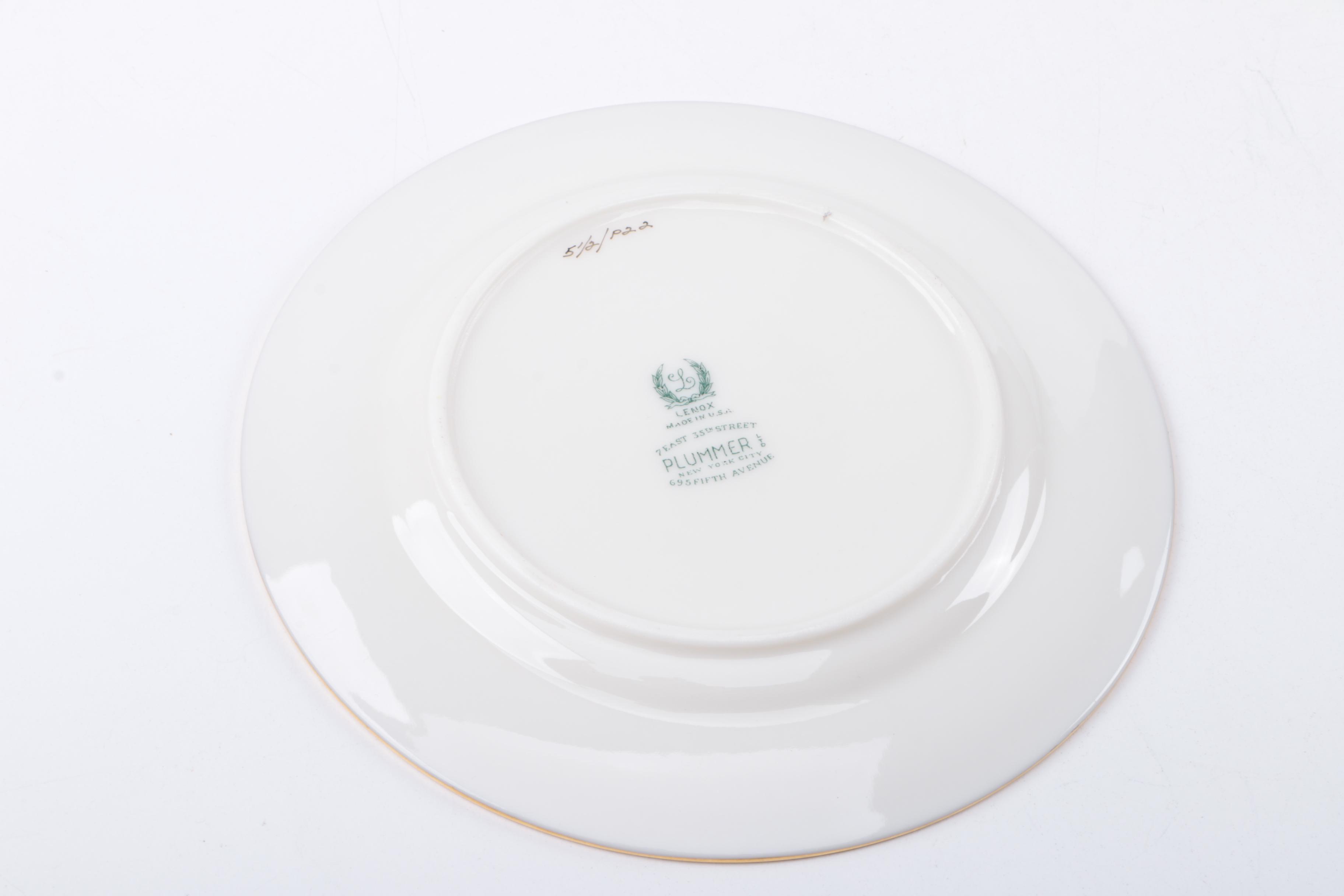 Gold Trimmed Porcelain Plates Featuring Wedgwood