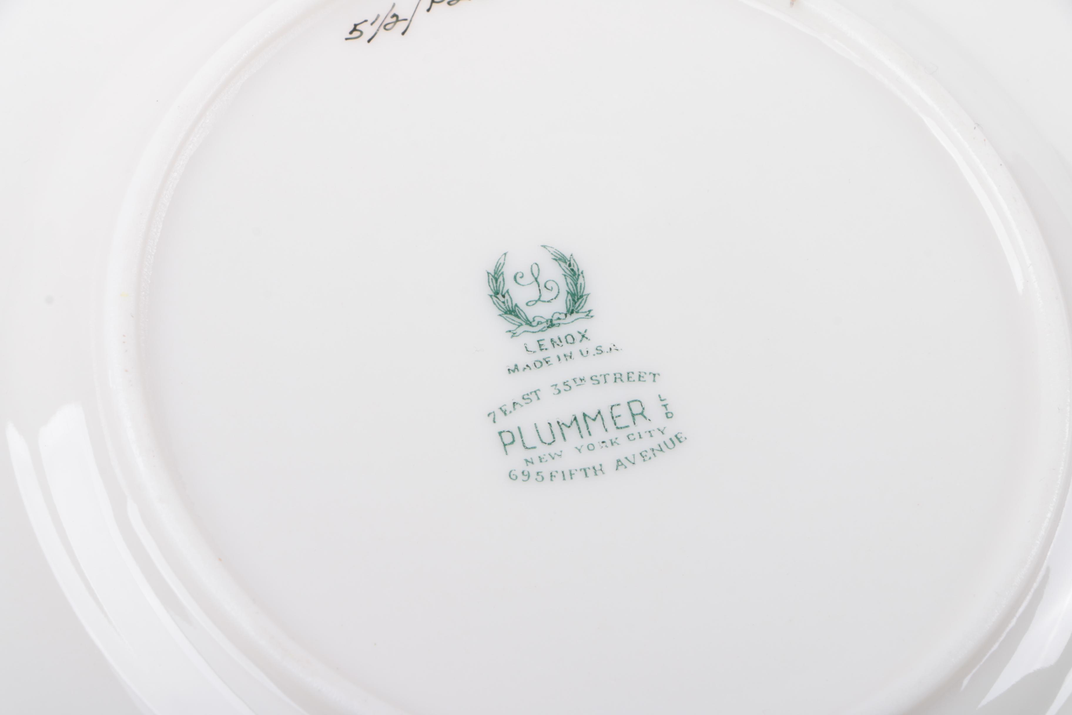 Gold Trimmed Porcelain Plates Featuring Wedgwood