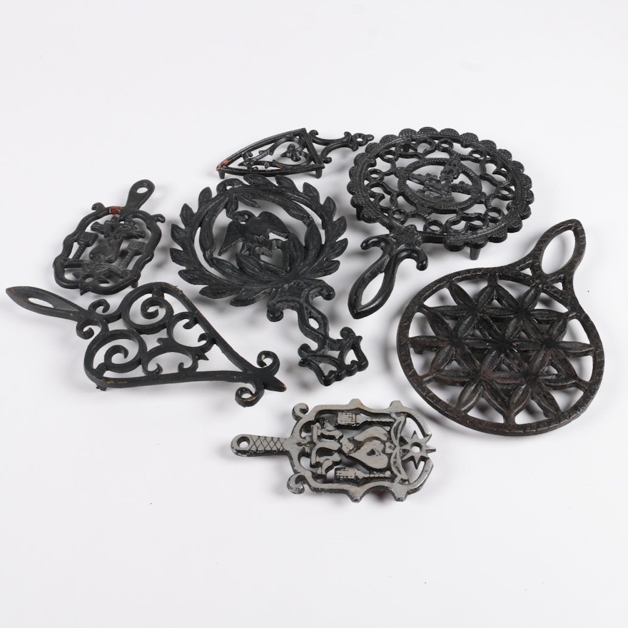 Seven Cast Metal Trivets