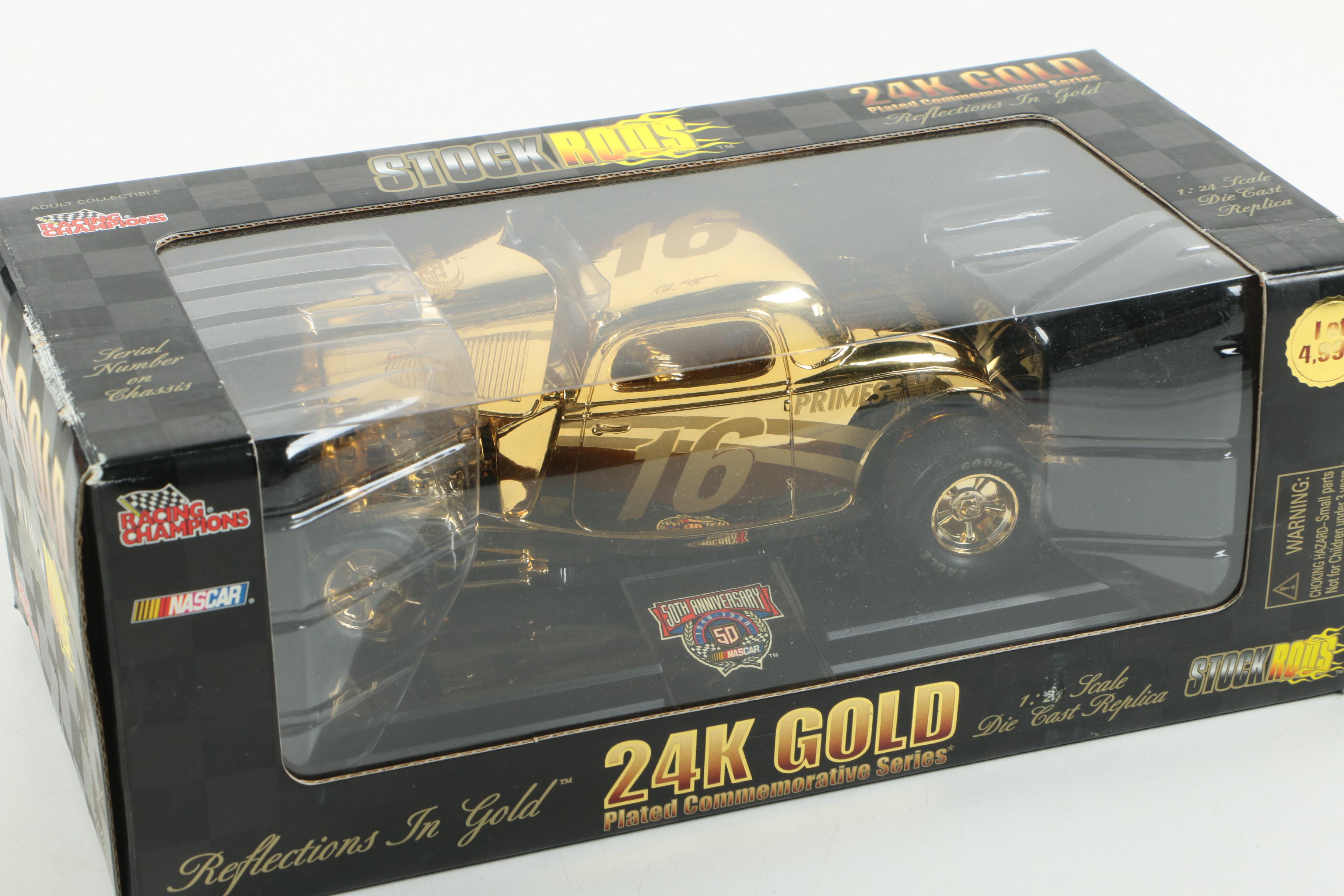 Four 24K Gold Racing Champions Die-Cast Cars
