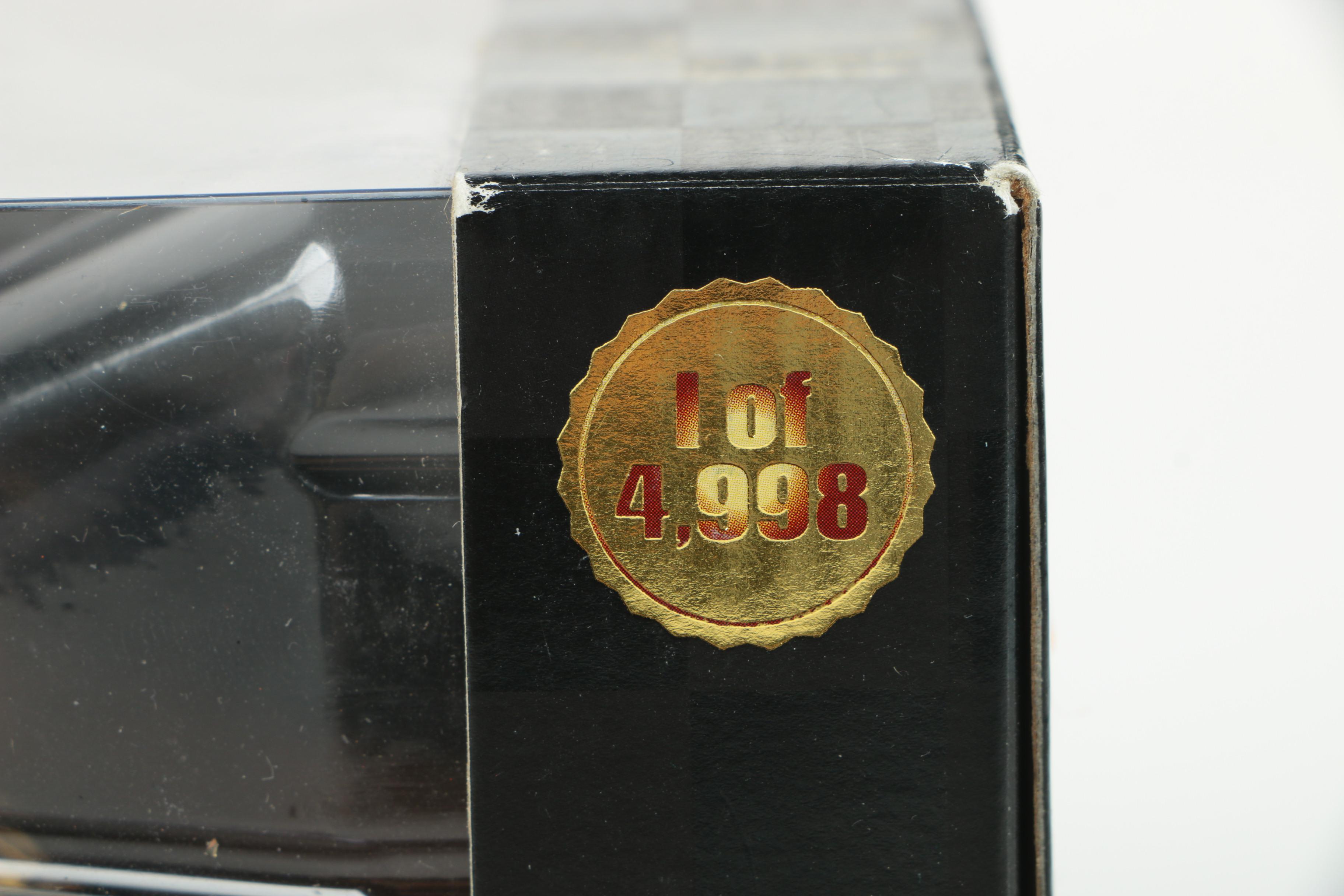 Four 24K Gold Racing Champions Die-Cast Cars