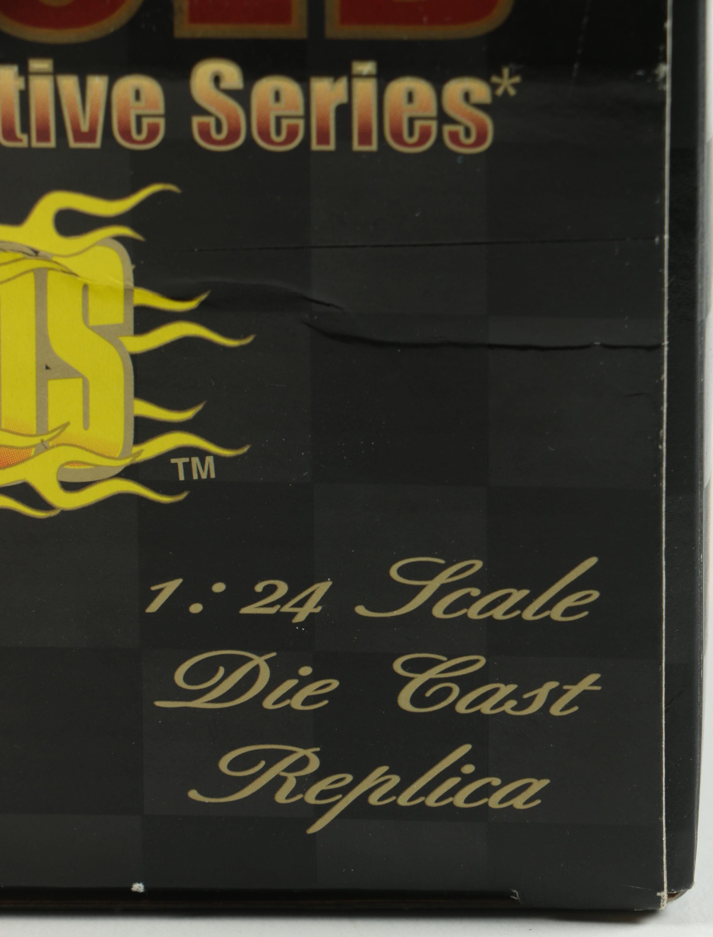 Four 24K Gold Racing Champions Die-Cast Cars