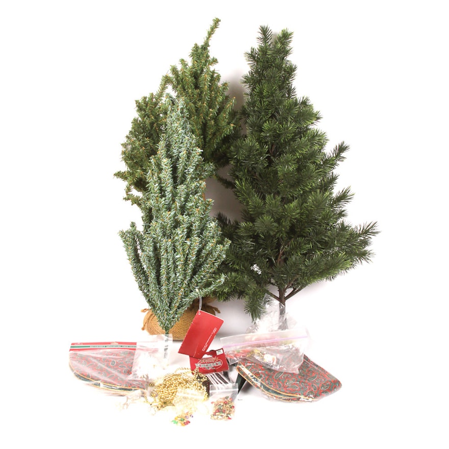 Collection of Faux Christmas Trees and Holiday Decorations