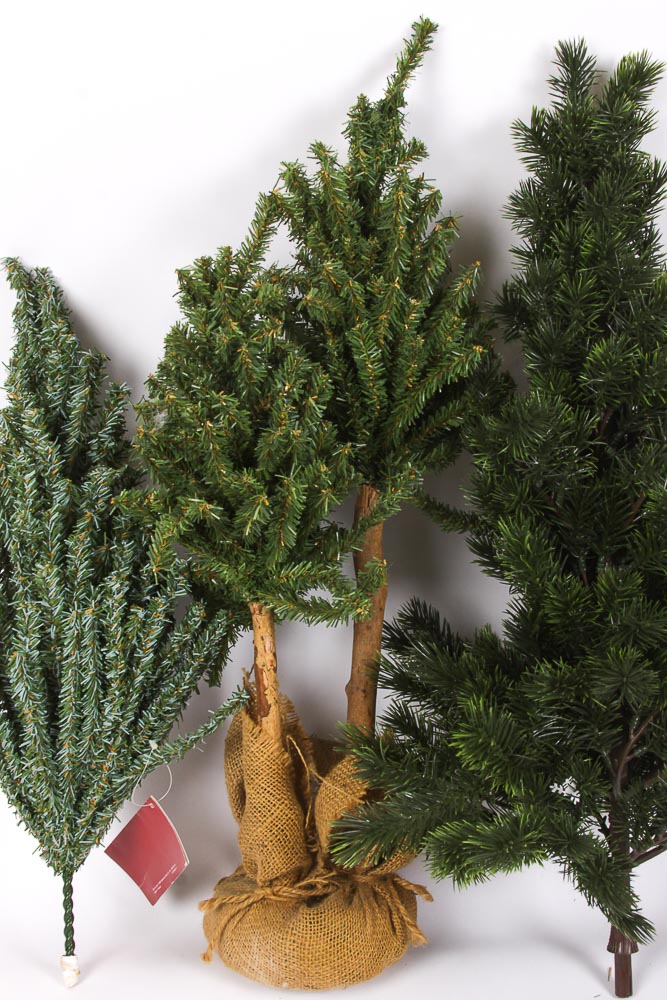 Collection of Faux Christmas Trees and Holiday Decorations
