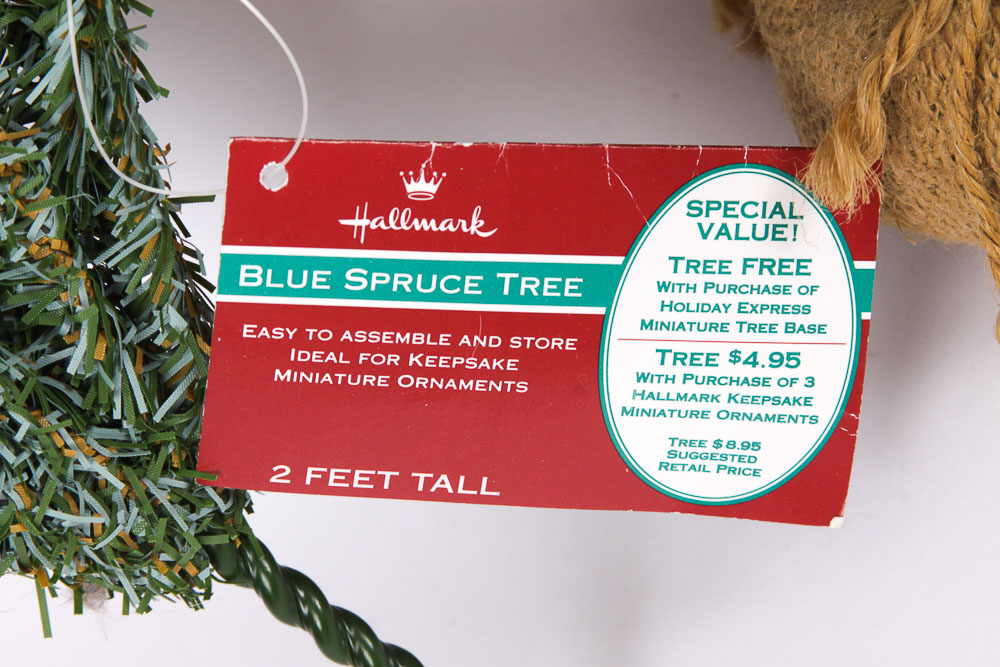 Collection of Faux Christmas Trees and Holiday Decorations