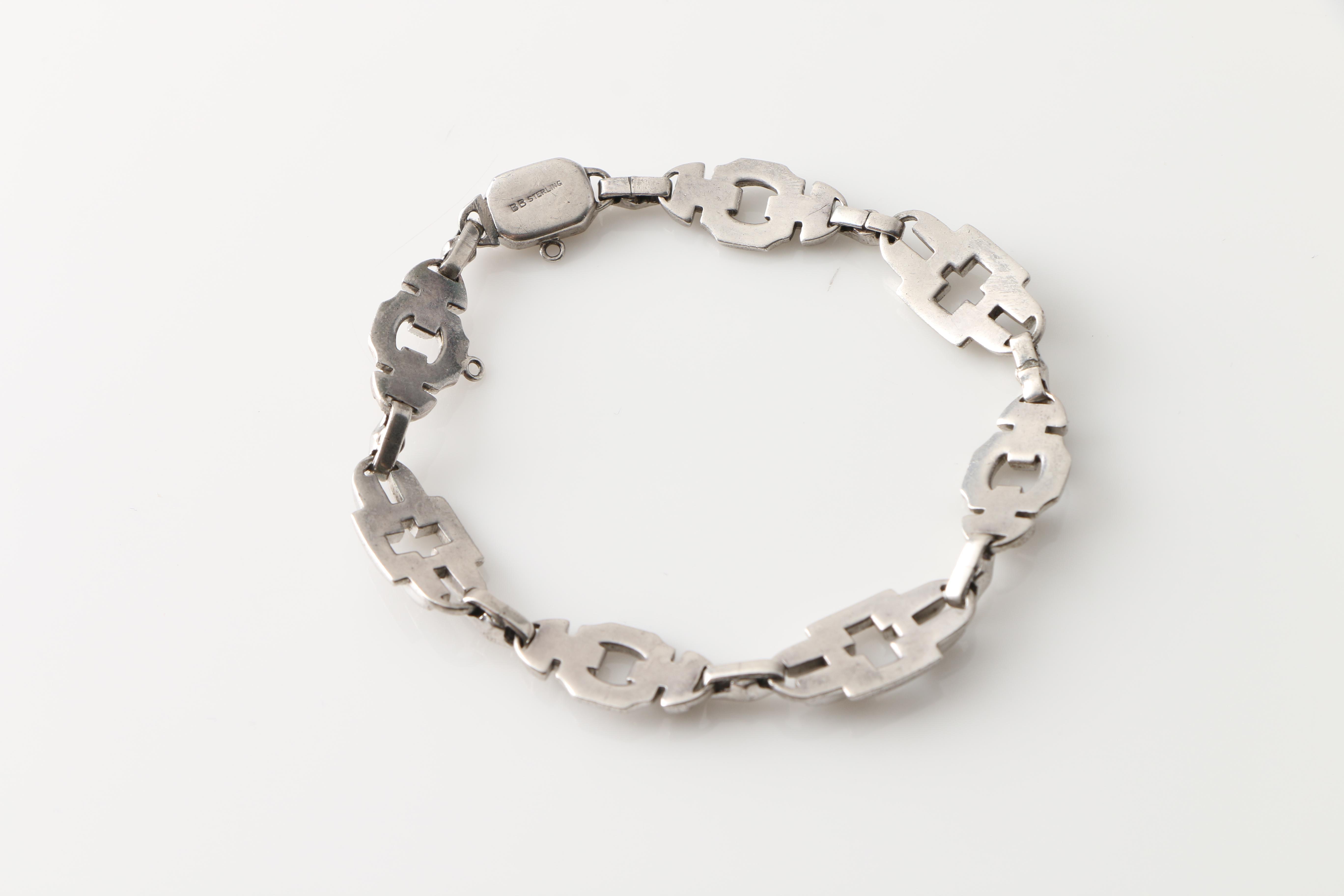 Grouping of Sterling Silver Bracelets Including an Australian Coin Bracelet