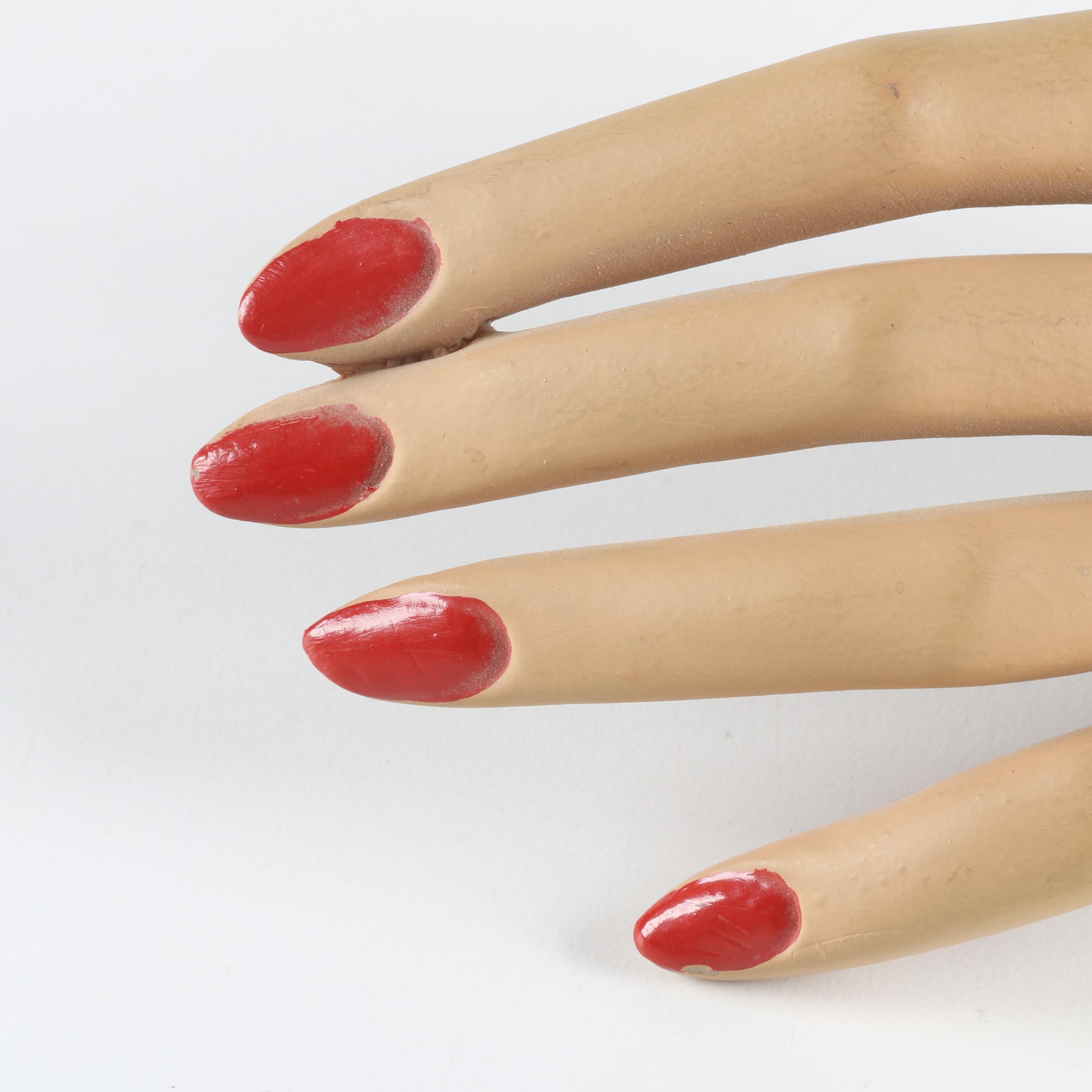 Red Nail Mannequin Hand with Brush