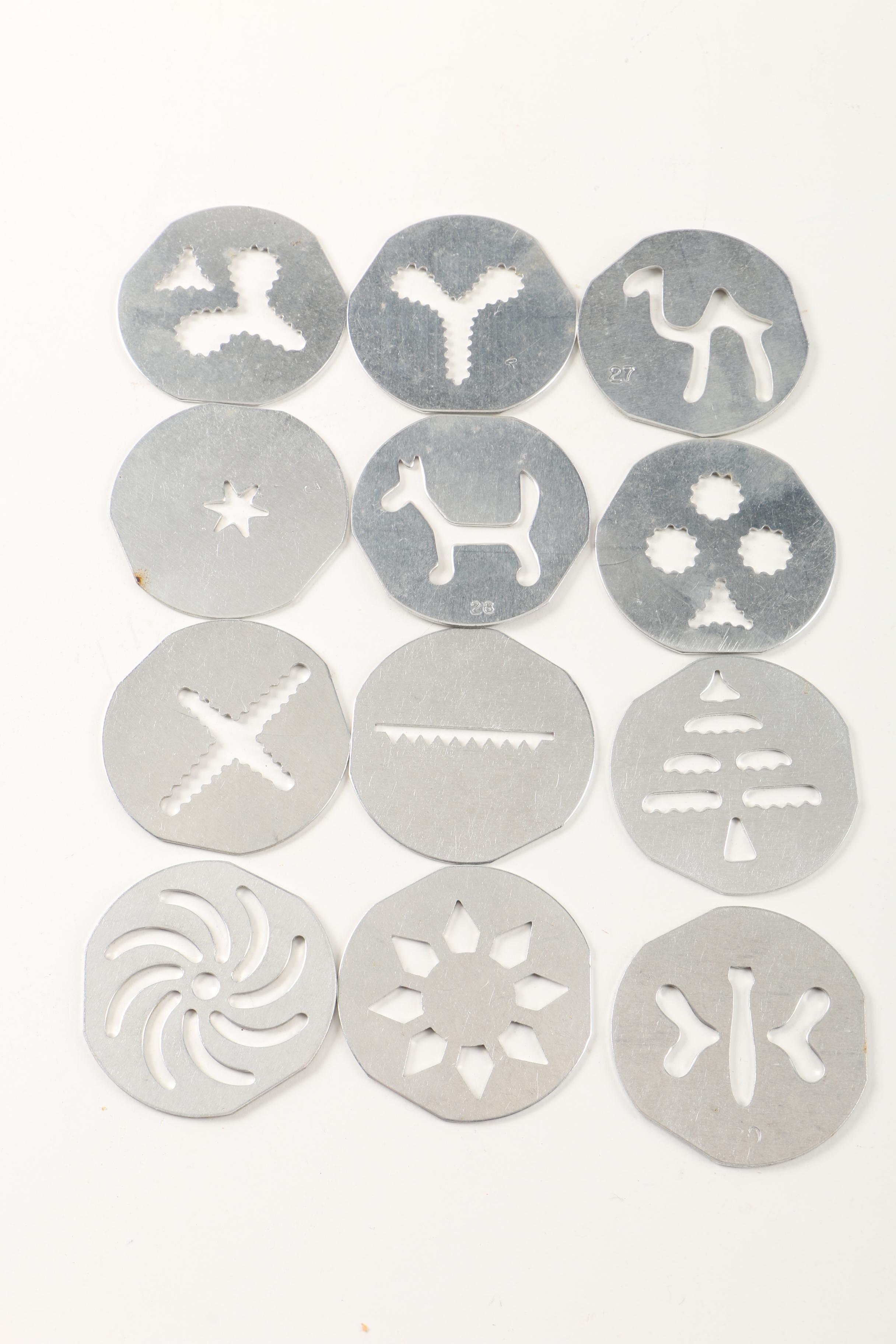 Assortment of kitchenwares featuring a Mirro cookie pastry press