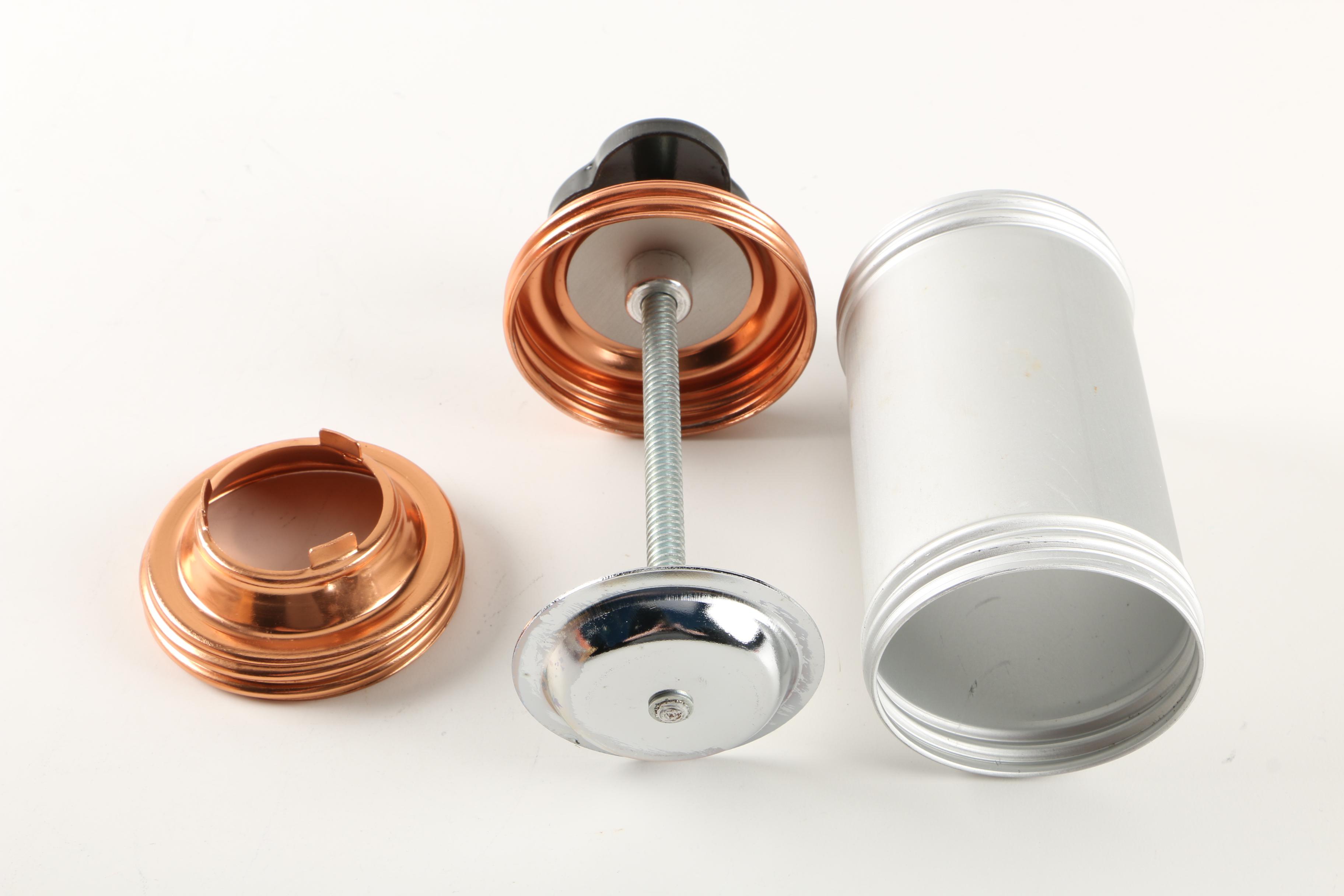 Assortment of kitchenwares featuring a Mirro cookie pastry press