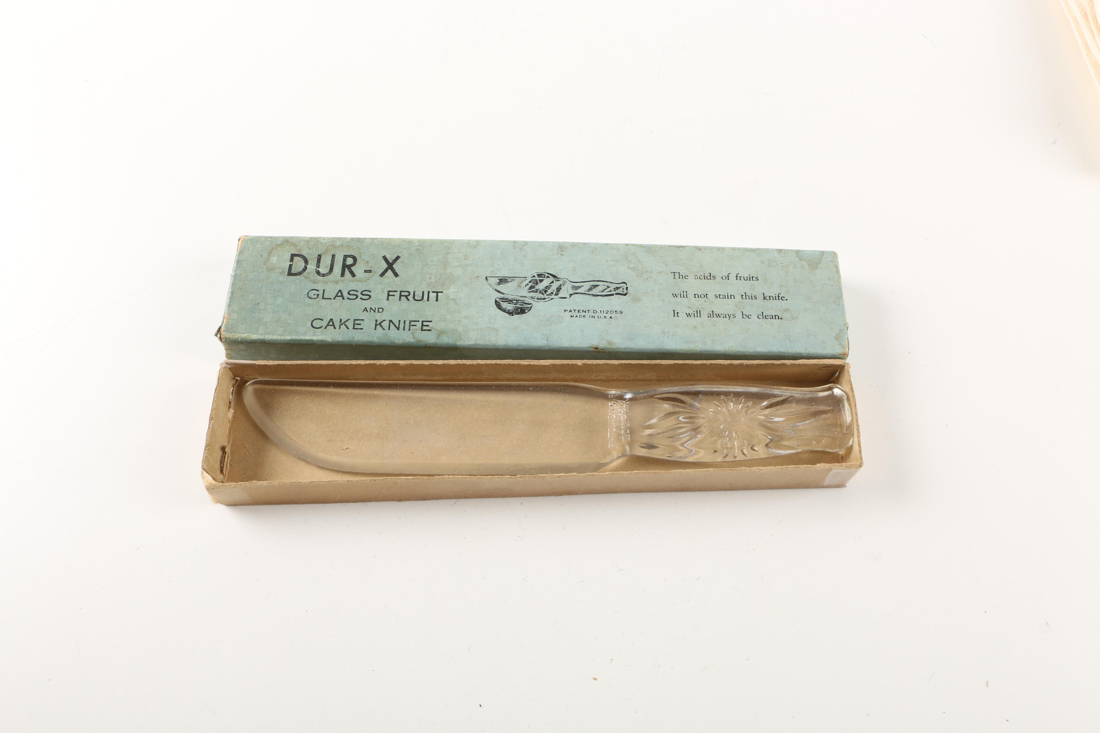 Assortment of kitchenwares featuring a Mirro cookie pastry press