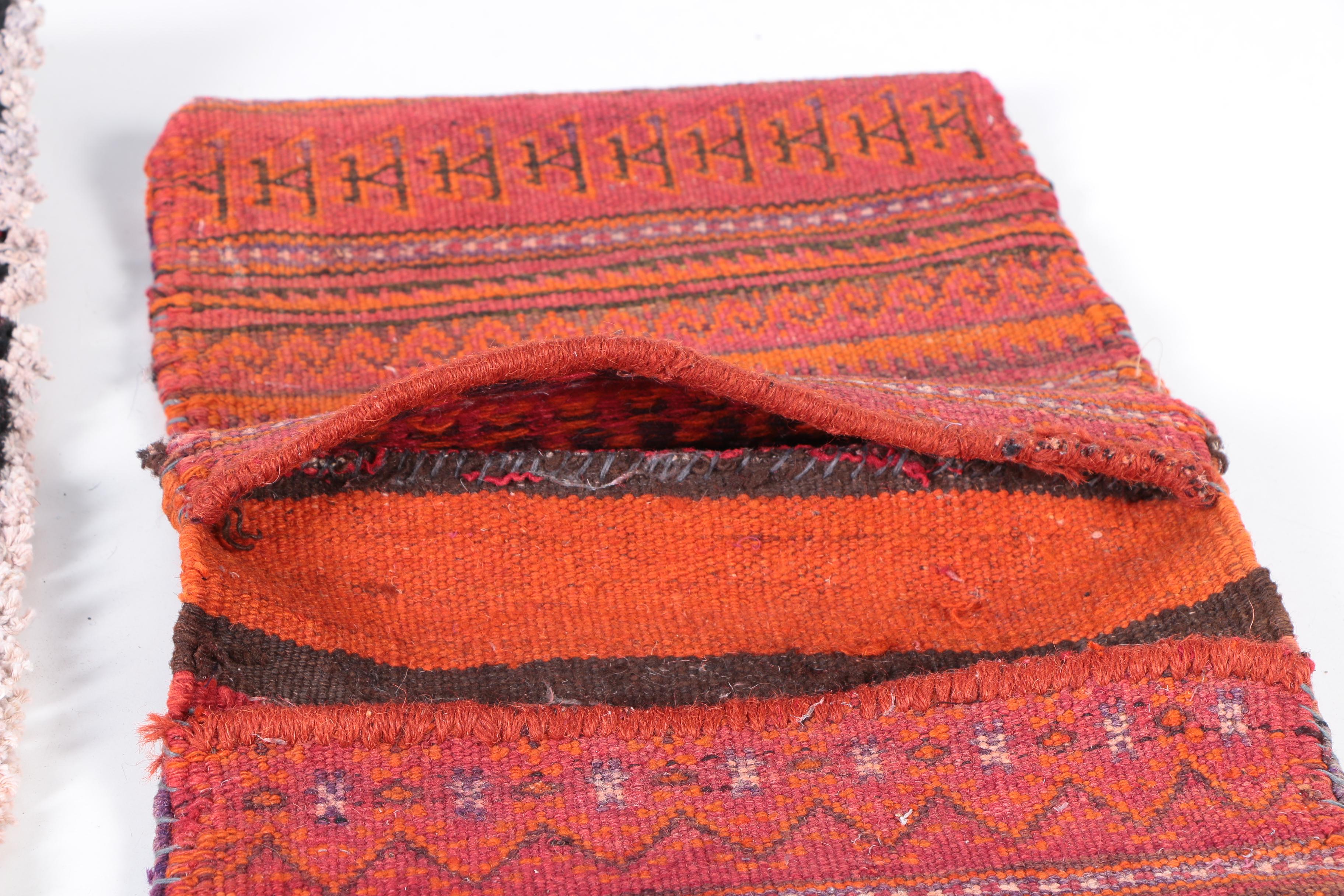 Hand-Knotted Turkmen Bokhara Wool Accent Rug and a Handwoven Saddle Bag