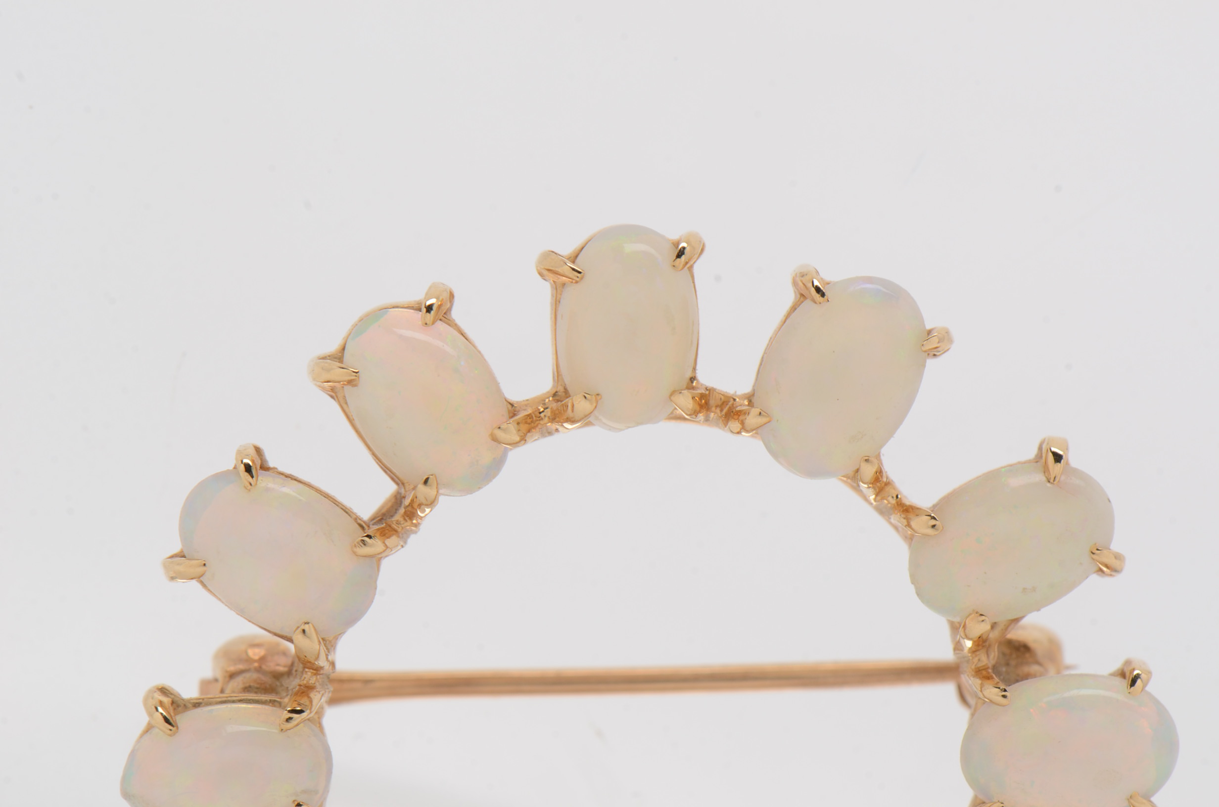 14K Yellow Gold Circle Brooch with Twelve Prong Set Opals