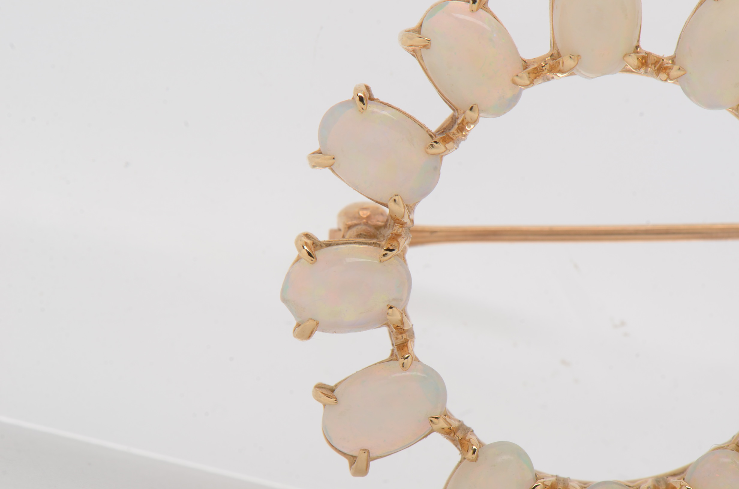 14K Yellow Gold Circle Brooch with Twelve Prong Set Opals
