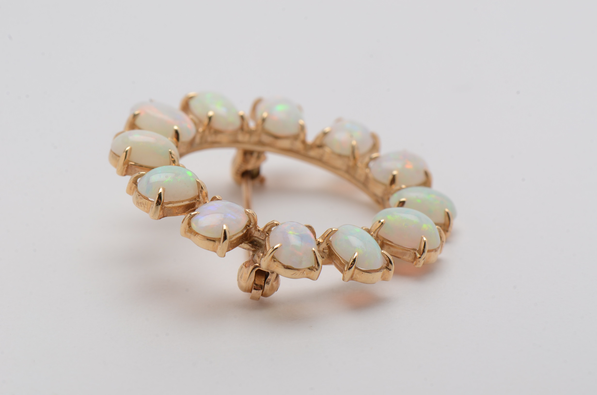 14K Yellow Gold Circle Brooch with Twelve Prong Set Opals