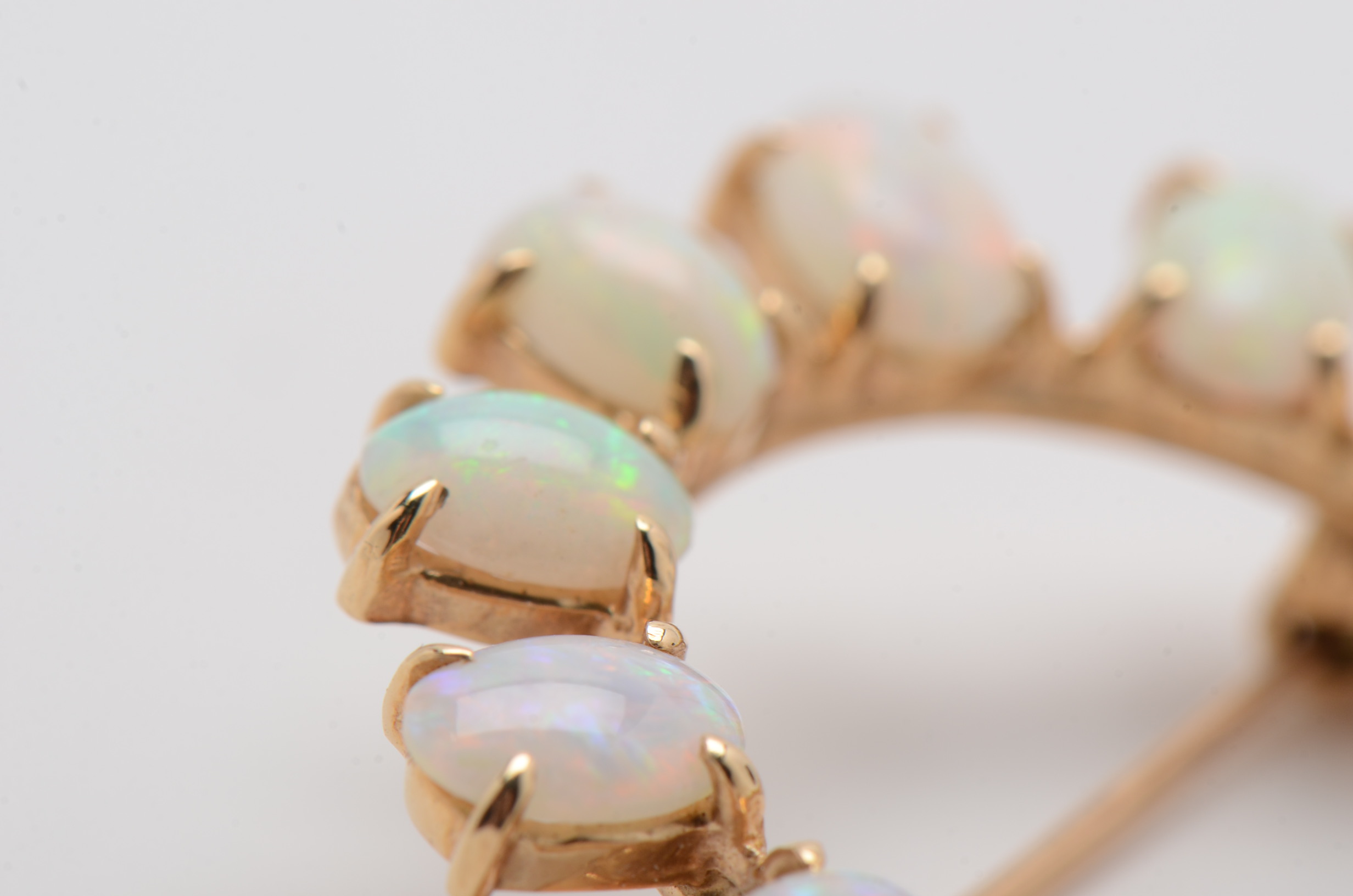 14K Yellow Gold Circle Brooch with Twelve Prong Set Opals