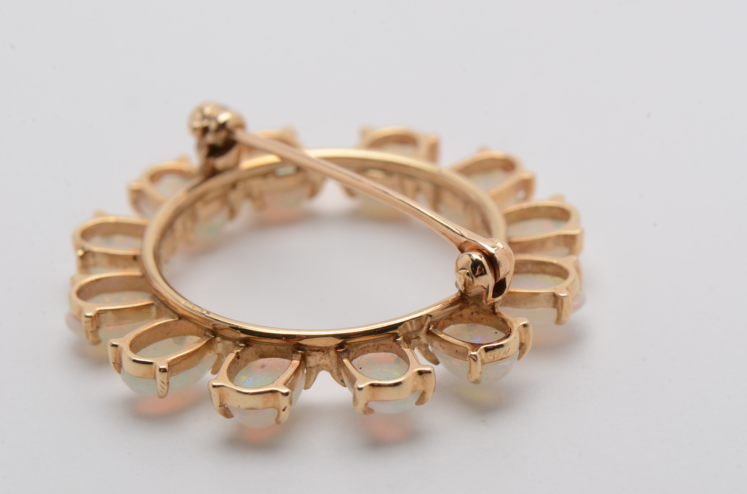 14K Yellow Gold Circle Brooch with Twelve Prong Set Opals