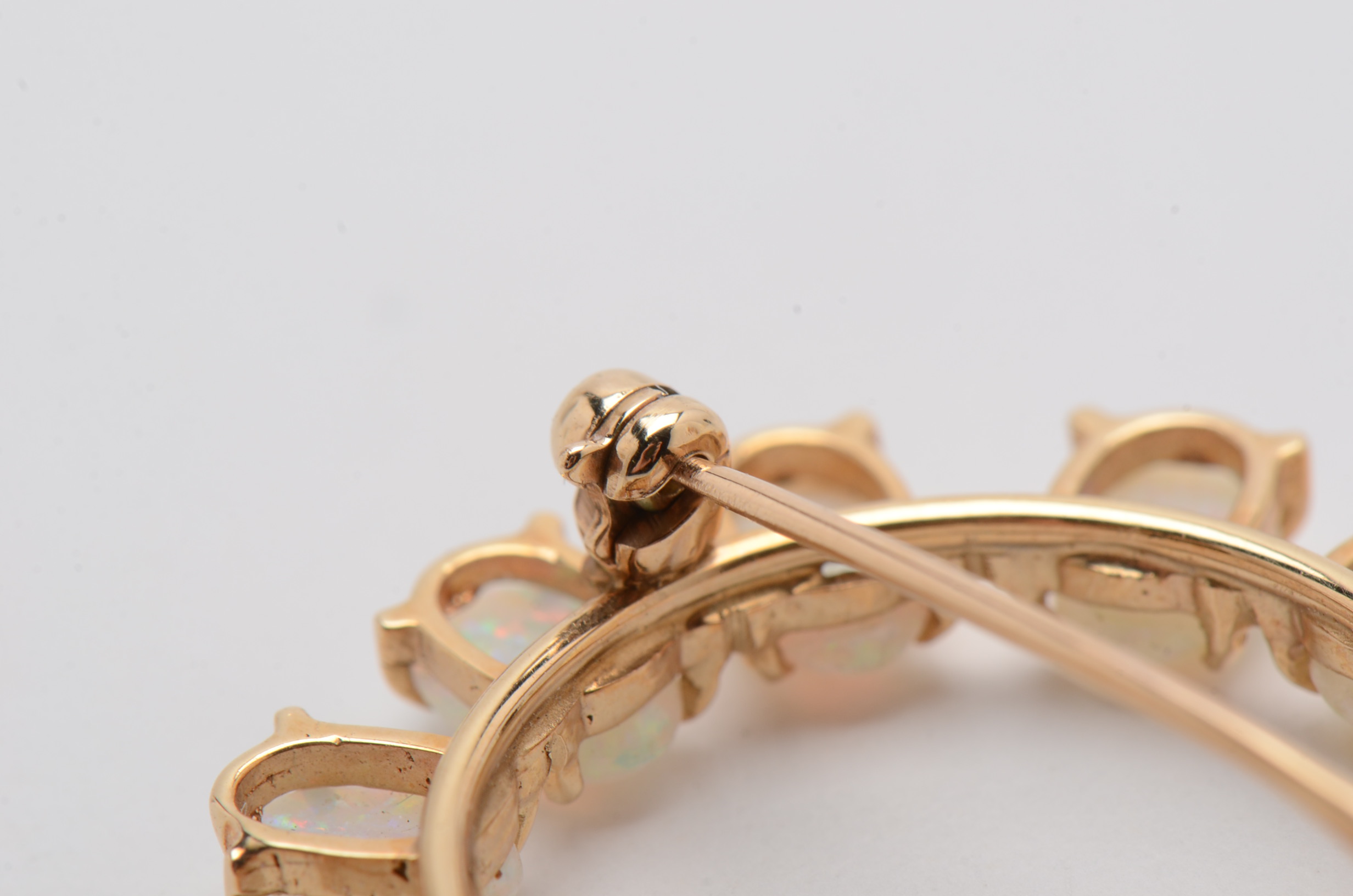 14K Yellow Gold Circle Brooch with Twelve Prong Set Opals