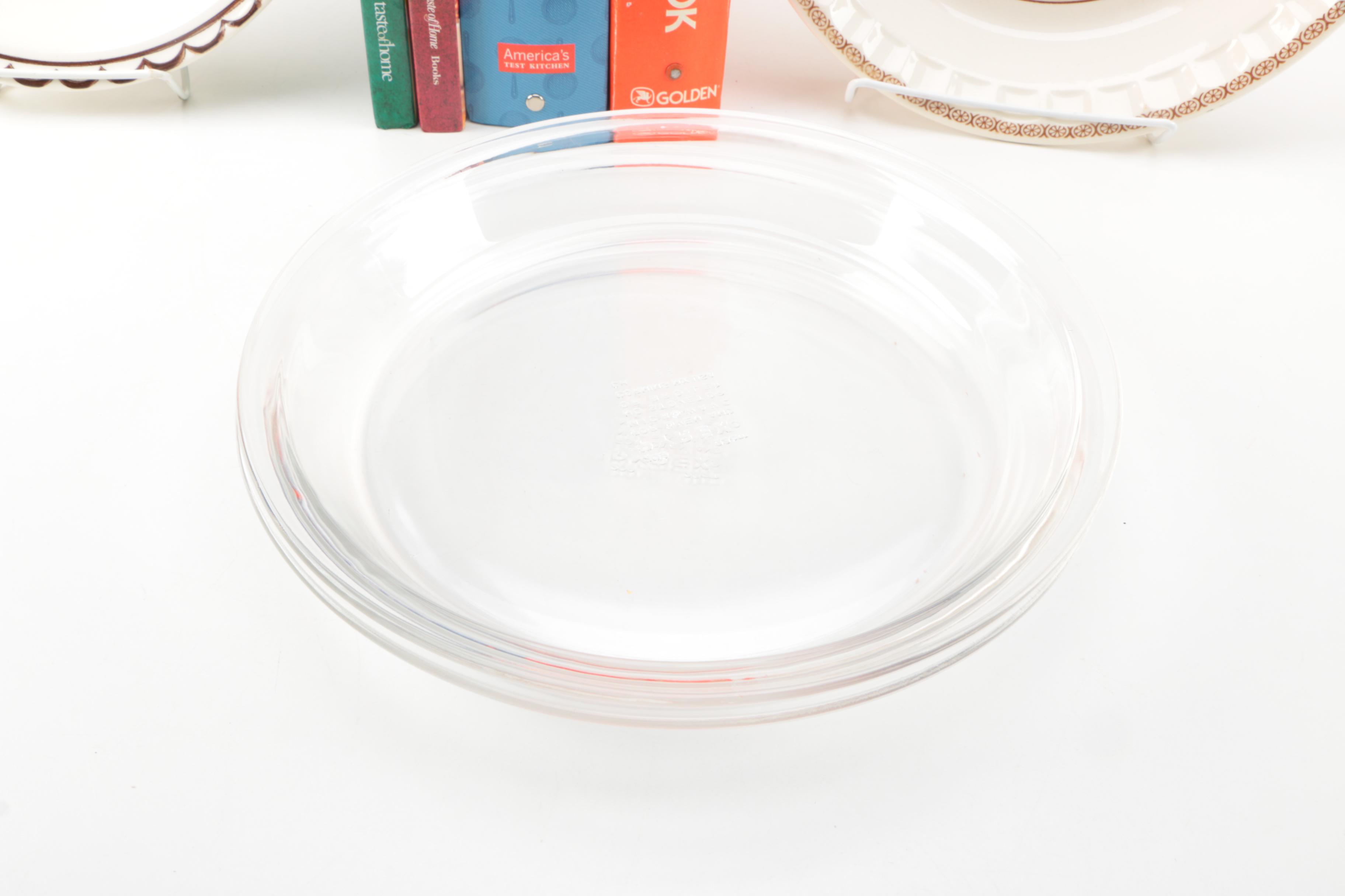 Assorted Cookbooks with Glass and Porcelain Dishes