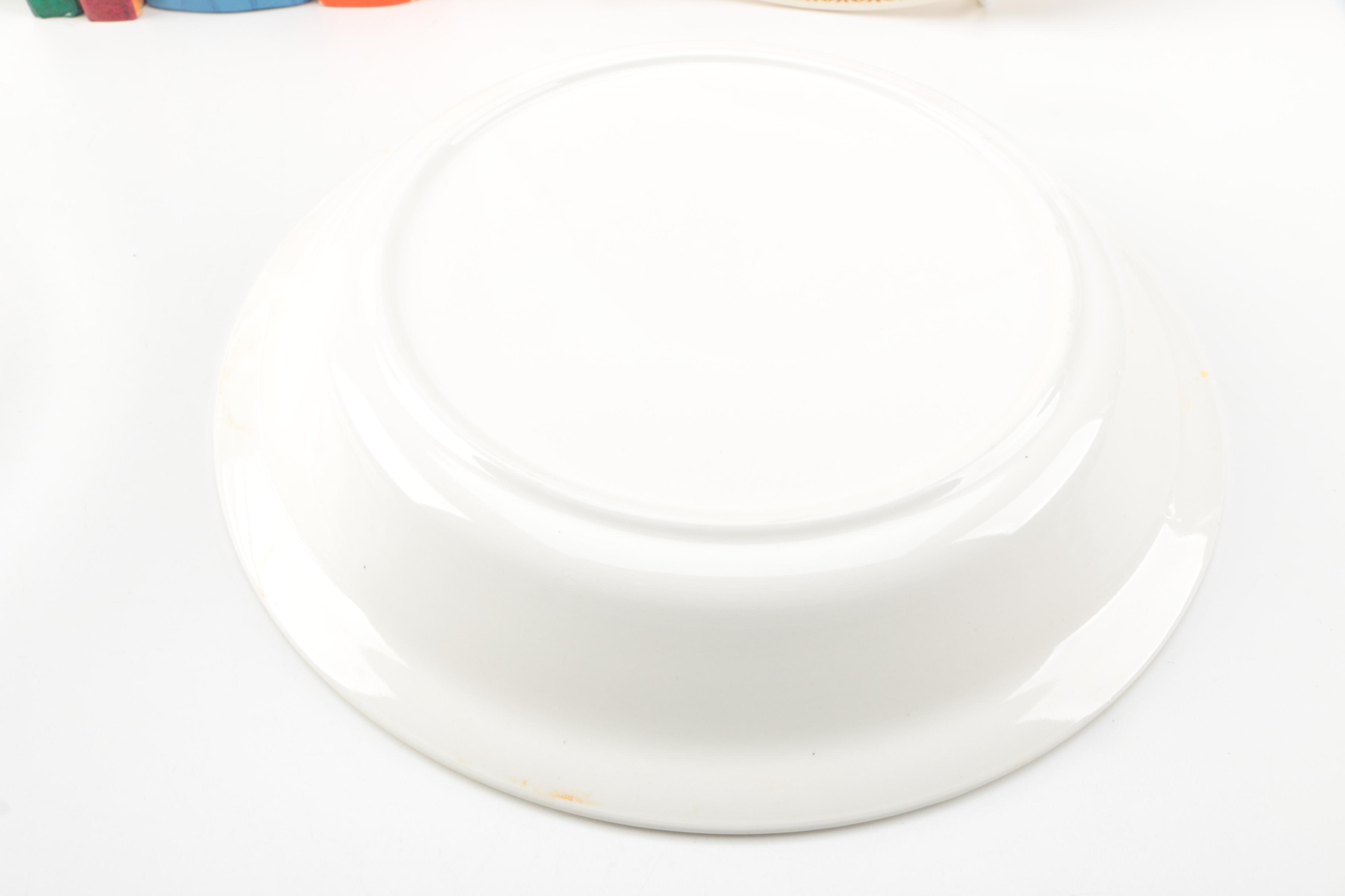 Assorted Cookbooks with Glass and Porcelain Dishes